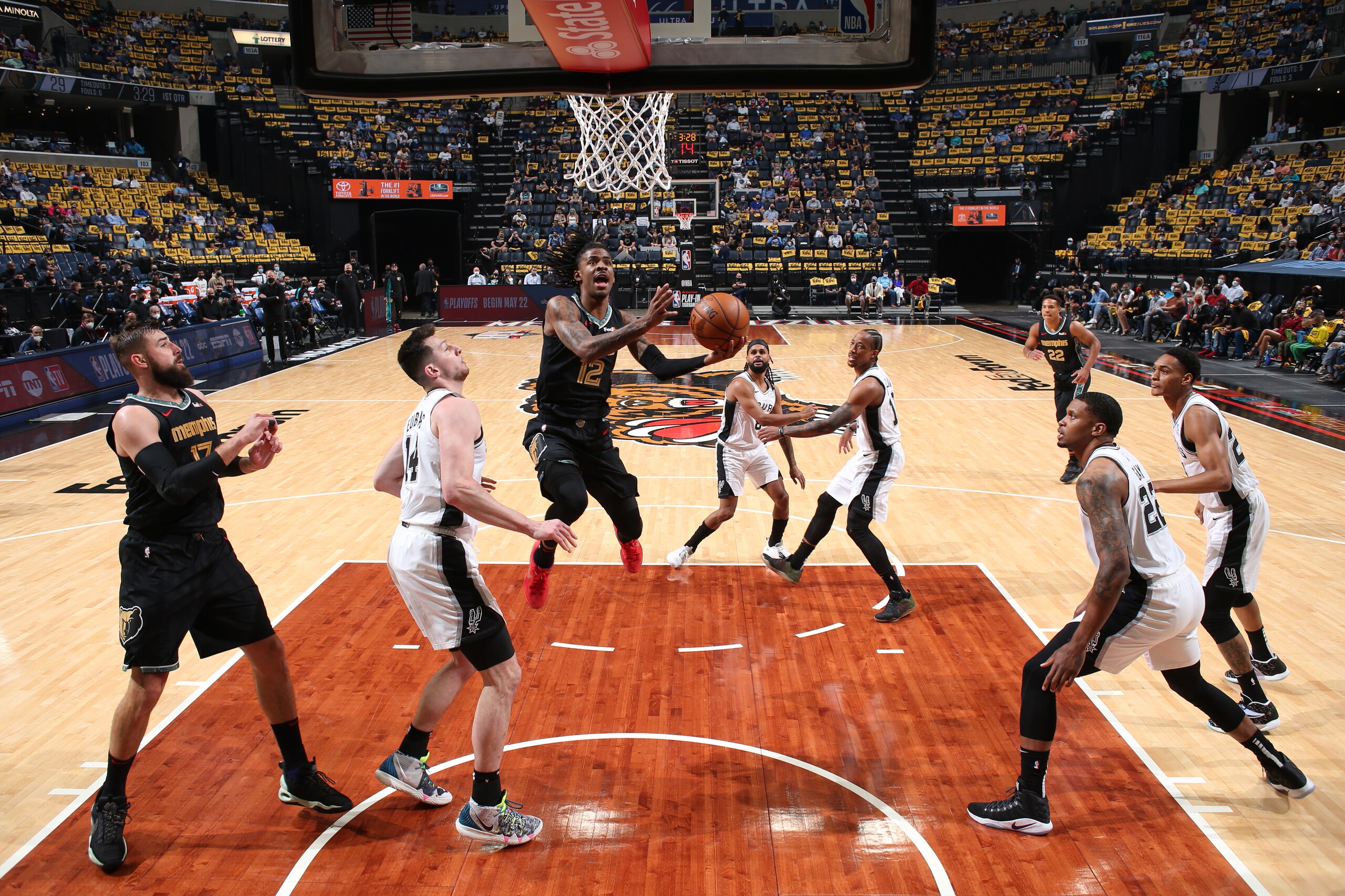 MEMPHIS, TN - MAY 19: Ja Morant #12 of the Memphis Grizzlies drives to the basket against the San Antonio Spurs during the 2021 NBA Play-In Tournament on May 19, 2021 at FedExForum in Memphis, Tennessee. NOTE TO USER: User expressly acknowledges and agrees that, by downloading and or using this photograph, User is consenting to the terms and conditions of the Getty Images License Agreement. Mandatory Copyright Notice: Copyright 2021 NBAE (Photo by Joe Murphy/NBAE via Getty Images)