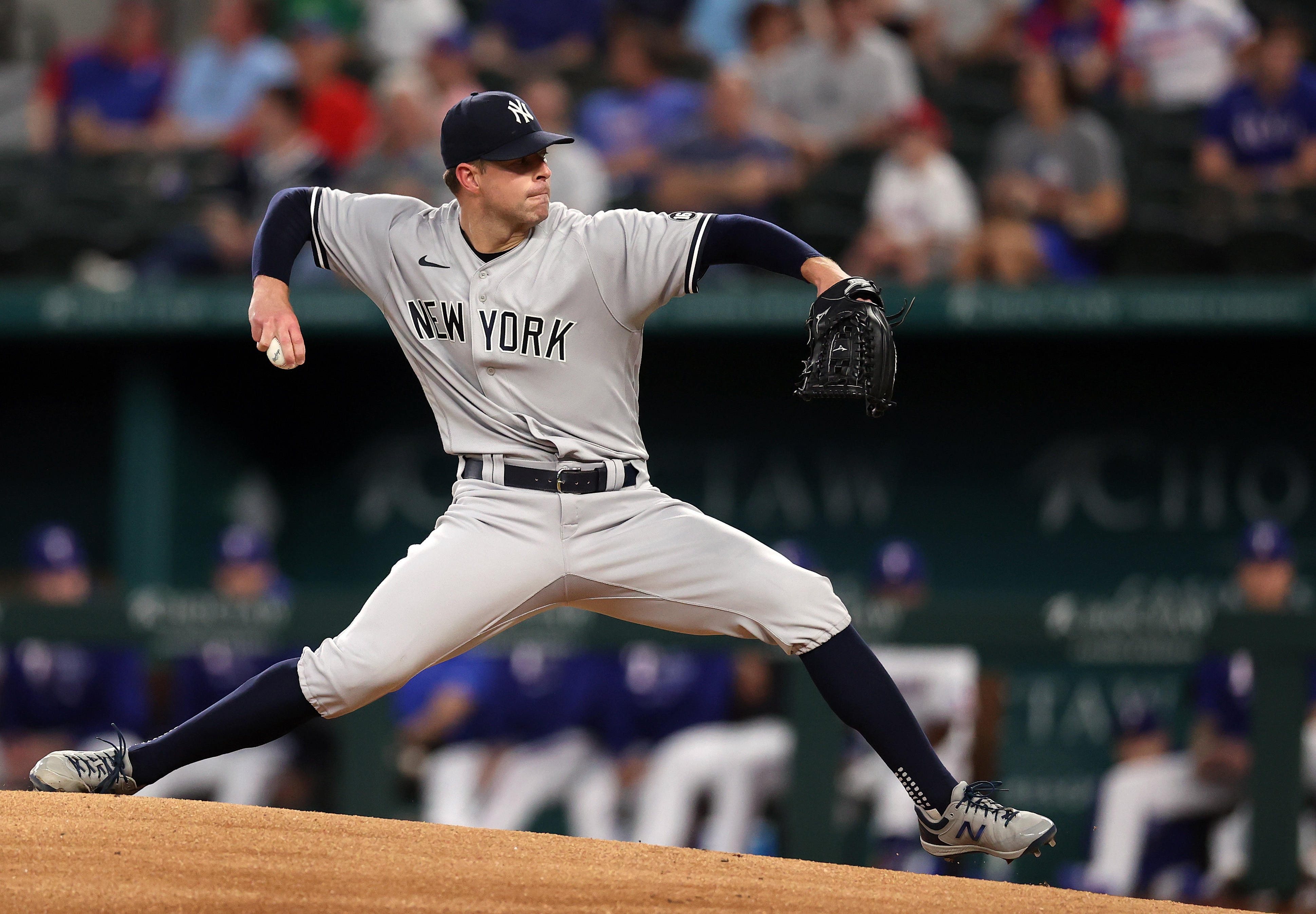 ARLINGTON, TEXAS - MAY 19:  Corey Kluber #28 of the New York Yankees throws against the Texas Rangers in the first inning at Globe Life Field on May 19, 2021 in Arlington, Texas. (Photo by Ronald Martinez/Getty Images)