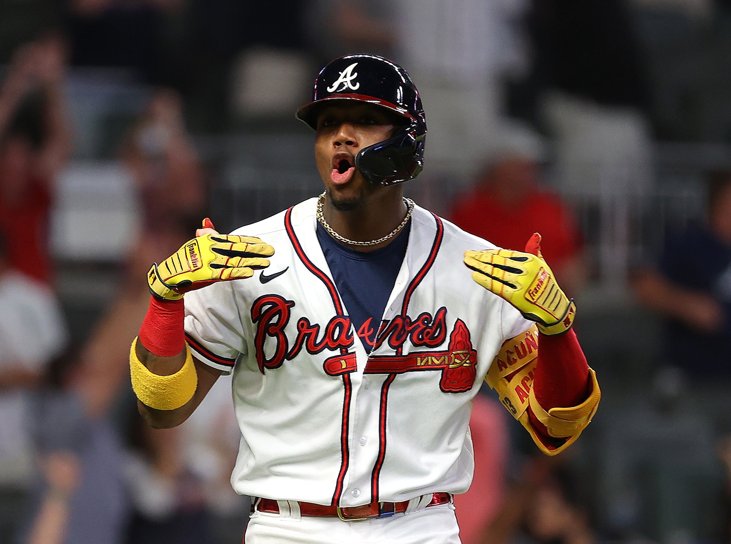 ATLANTA, GEORGIA - MAY 19:  Ronald Acuna Jr. #13 of the Atlanta Braves reacts after hitting a walk-off homer in the ninth inning against the New York Mets at Truist Park on May 19, 2021 in Atlanta, Georgia. (Photo by Kevin C. Cox/Getty Images)