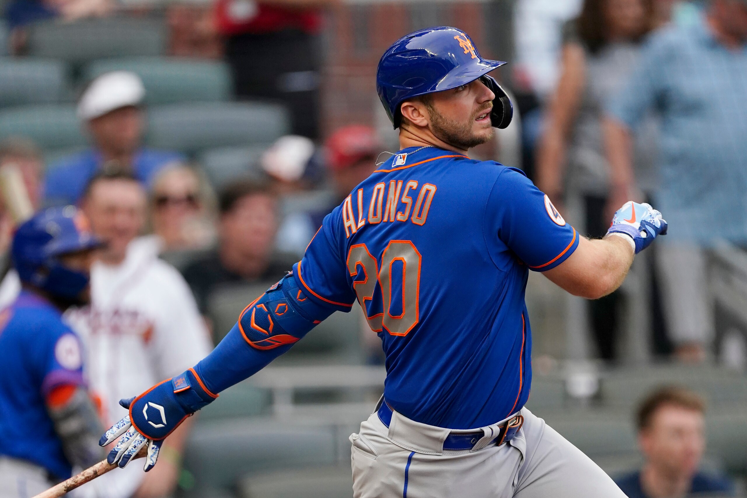 New York Mets first baseman Pete Alonso (20) follows through on a base hit in the first inning of a baseball game against the Atlanta Braves, Monday, May 17, 2021, in Atlanta. (AP Photo/John Bazemore) New York Mets first baseman Pete Alonso (20) follows through on a base hit in the first inning of a baseball game against the Atlanta Braves, Monday, May 17, 2021, in Atlanta. (AP Photo/John Bazemore)