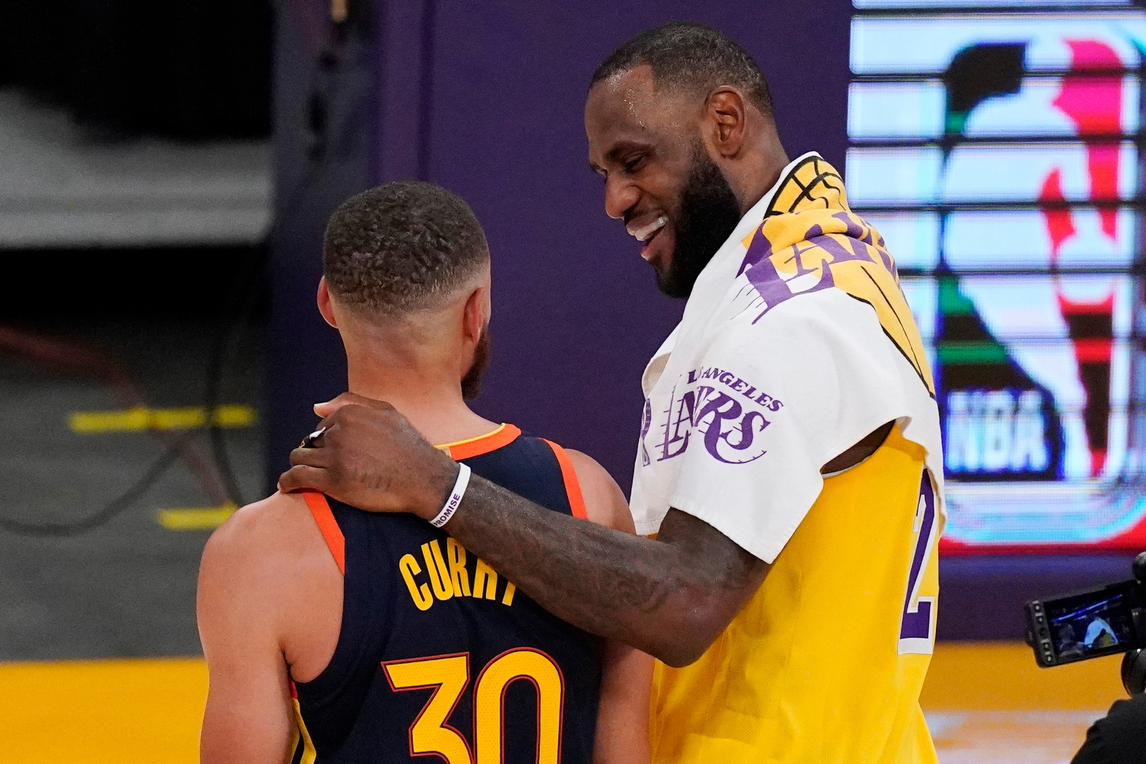 Los Angeles Lakers forward LeBron James, right, greets Golden State Warriors guard Stephen Curry after the Lakers defeated the Golden State Warriors 103-100 in an NBA basketball Western Conference Play-In game Wednesday, May 19, 2021, in Los Angeles. (AP Photo/Mark J. Terrill) Los Angeles Lakers forward LeBron James, right, greets Golden State Warriors guard Stephen Curry after the Lakers defeated the Golden State Warriors 103-100 in an NBA basketball Western Conference Play-In game Wednesday, May 19, 2021, in Los Angeles. (AP Photo/Mark J. Terrill)