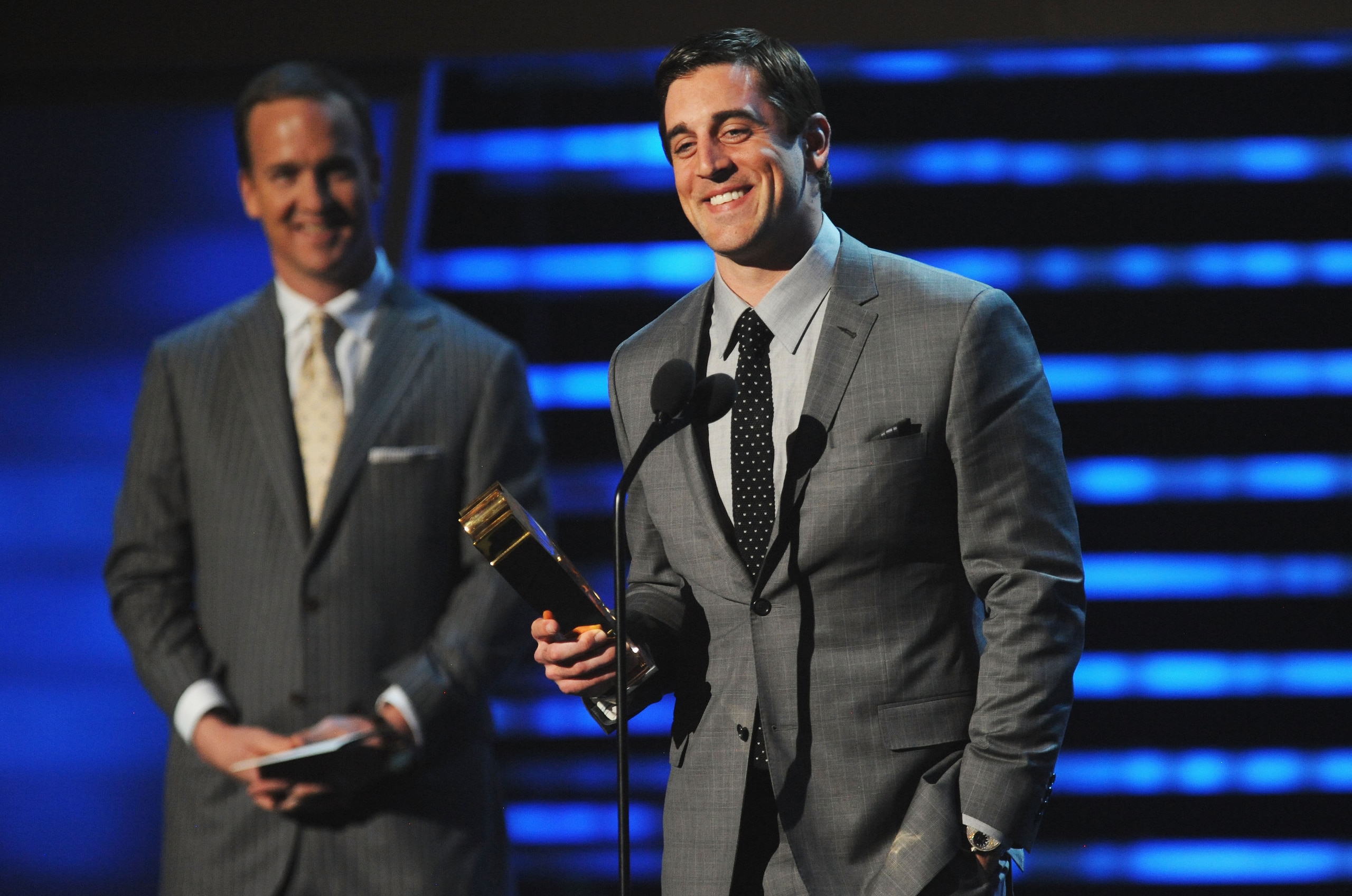 INDIANAPOLIS, IN - FEBRUARY 04:  Professional Football Players Peyton Manning (L) and Aaron Rodgers speak during the 2012 NFL Honors at the Murat Theatre on February 4, 2012 in Indianapolis, Indiana.  (Photo by Kevin Mazur/WireImage)