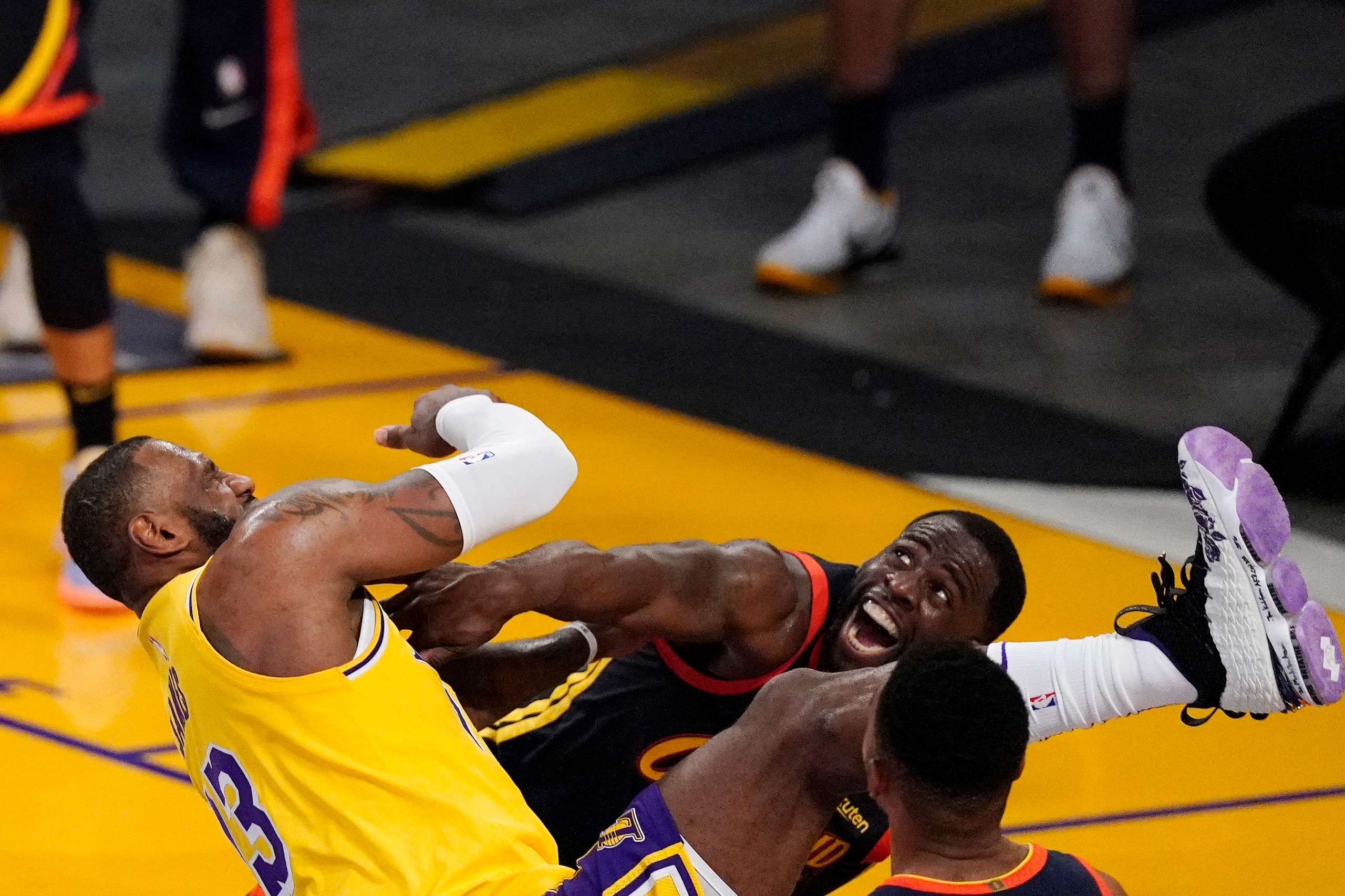 Los Angeles Lakers forward LeBron James, left, is fouled while shooting by Golden State Warriors forward Draymond Green during the second half of an NBA basketball Western Conference Play-In game Wednesday, May 19, 2021, in Los Angeles. (AP Photo/Mark J. Terrill) Los Angeles Lakers forward LeBron James, left, is fouled while shooting by Golden State Warriors forward Draymond Green during the second half of an NBA basketball Western Conference Play-In game Wednesday, May 19, 2021, in Los Angeles. (AP Photo/Mark J. Terrill)