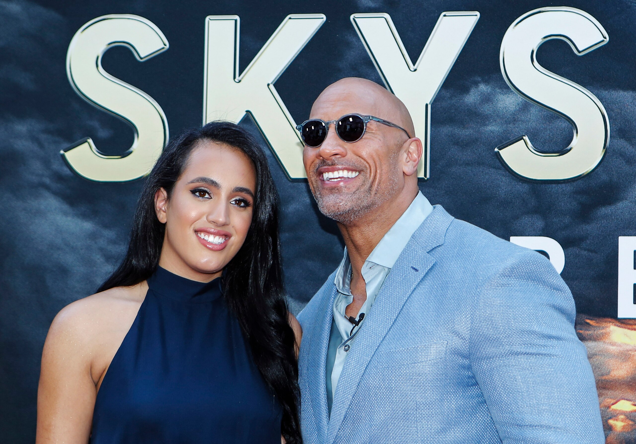 Actor Dwayne Johnson and his daughter Simone Alexandra Johnson attend the premiere of 'Skyscraper' on July 10, 2018 in New York City. (Photo by KENA BETANCUR / AFP) (Photo credit should read KENA BETANCUR/AFP via Getty Images) Actor Dwayne Johnson and his daughter Simone Alexandra Johnson attend the premiere of 'Skyscraper' on July 10, 2018 in New York City. (Photo by KENA BETANCUR / AFP) (Photo credit should read KENA BETANCUR/AFP via Getty Images)