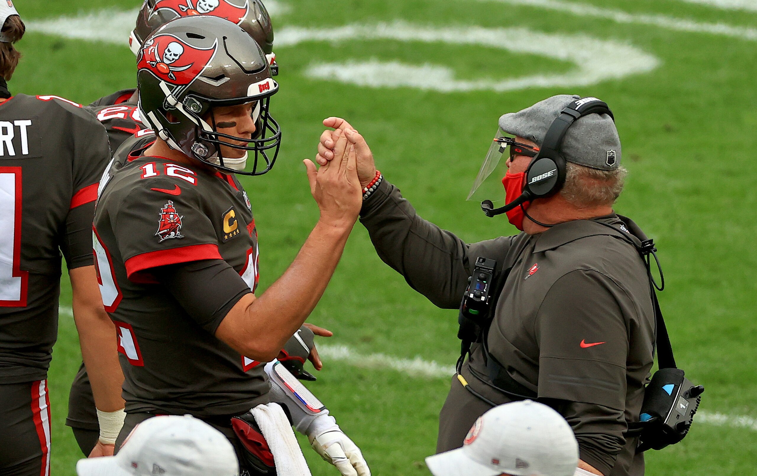 TAMPA, FLORIDA - JANUARY 03: Tom Brady #12 of the Tampa Bay Buccaneers celebrates a touchdown with head coach Bruce Arians of the Tampa Bay Buccaneers during a game against the Atlanta Falcons at Raymond James Stadium on January 03, 2021 in Tampa, Florida. (Photo by Mike Ehrmann/Getty Images)