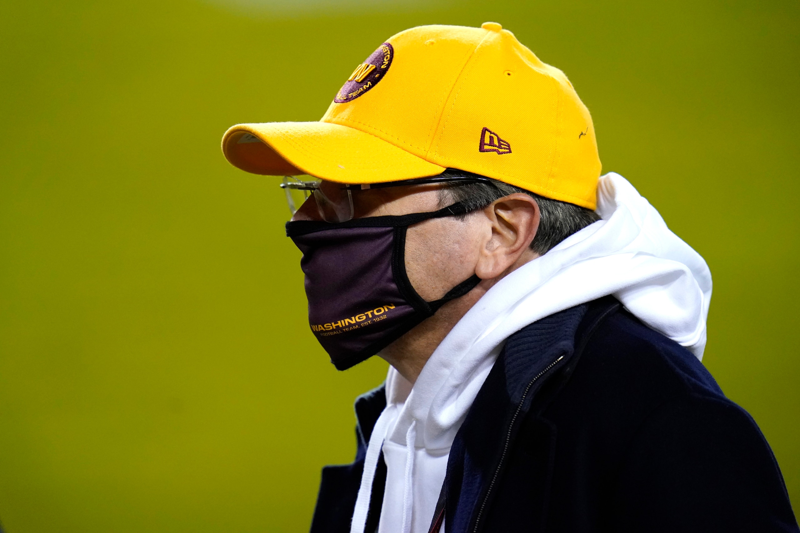 Washington Football Team owner Daniel Snyder walks on the field prior to an NFL wild-card playoff football game against the Tampa Bay Buccaneers, Saturday, Jan. 9, 2021, in Landover, Md. Tampa Bay won 31-23. (AP Photo/Julio Cortez)
