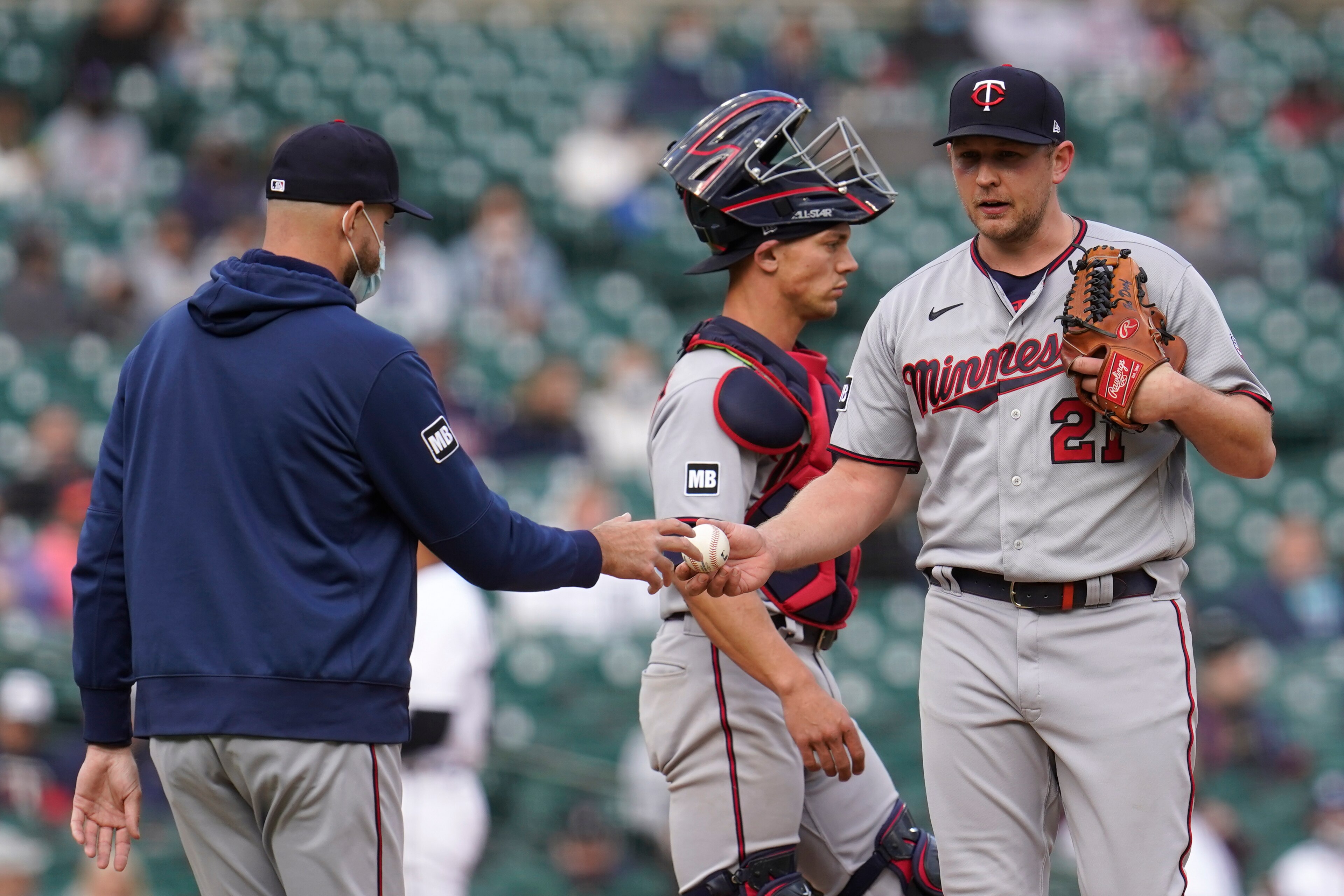 Minnesota Twins manager Rocco Baldelli takes the ball from relief pitcher Tyler Duffey (21) in the seventh inning of a baseball game against the Detroit Tigers in Detroit, Saturday, May 8, 2021. (AP Photo/Paul Sancya)