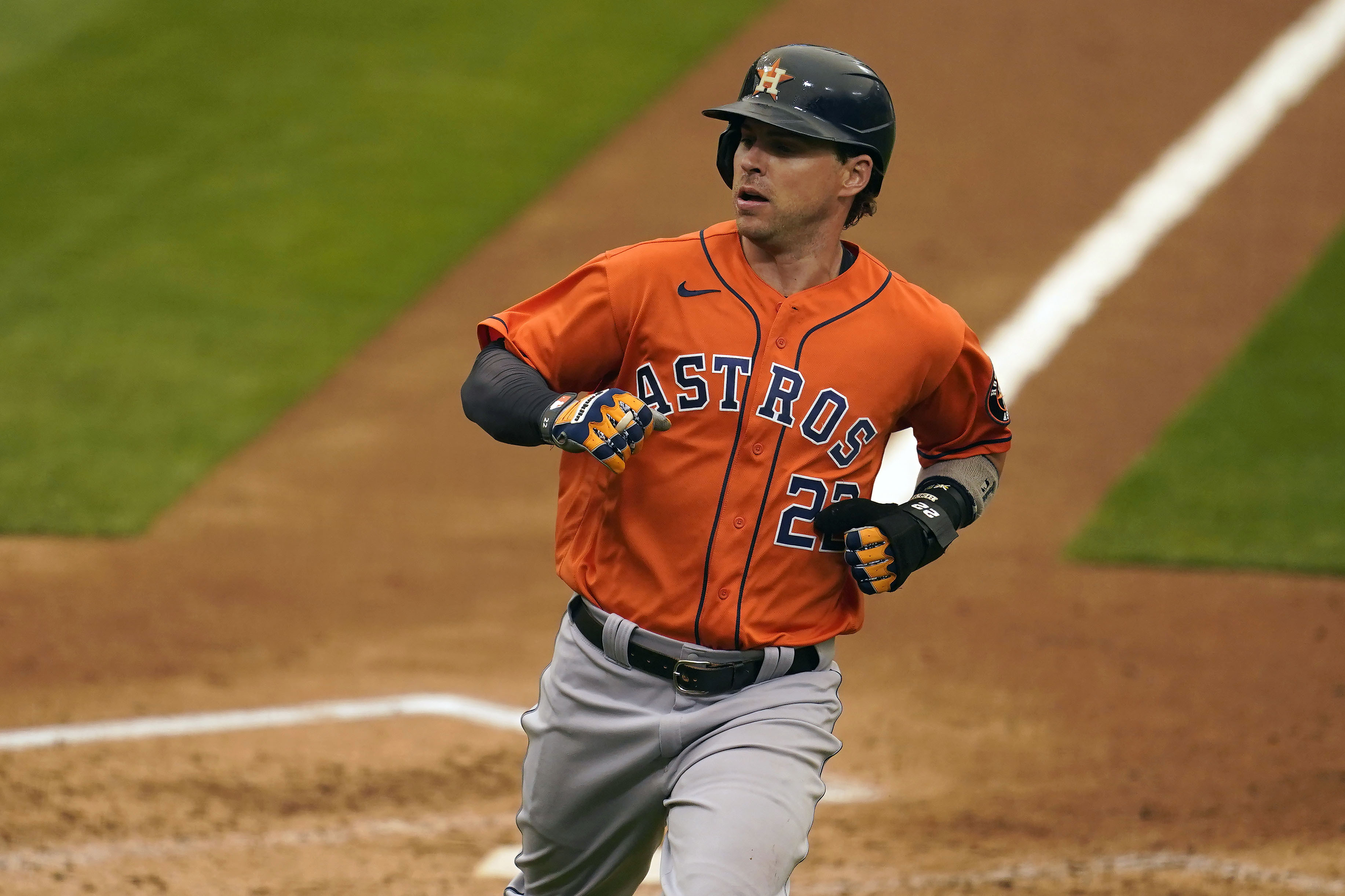 Houston Astros' Josh Reddick scores against the Oakland Athletics during the sixth inning of a baseball game in Oakland, Calif., Thursday, Sept. 10, 2020. (AP Photo/Jeff Chiu)