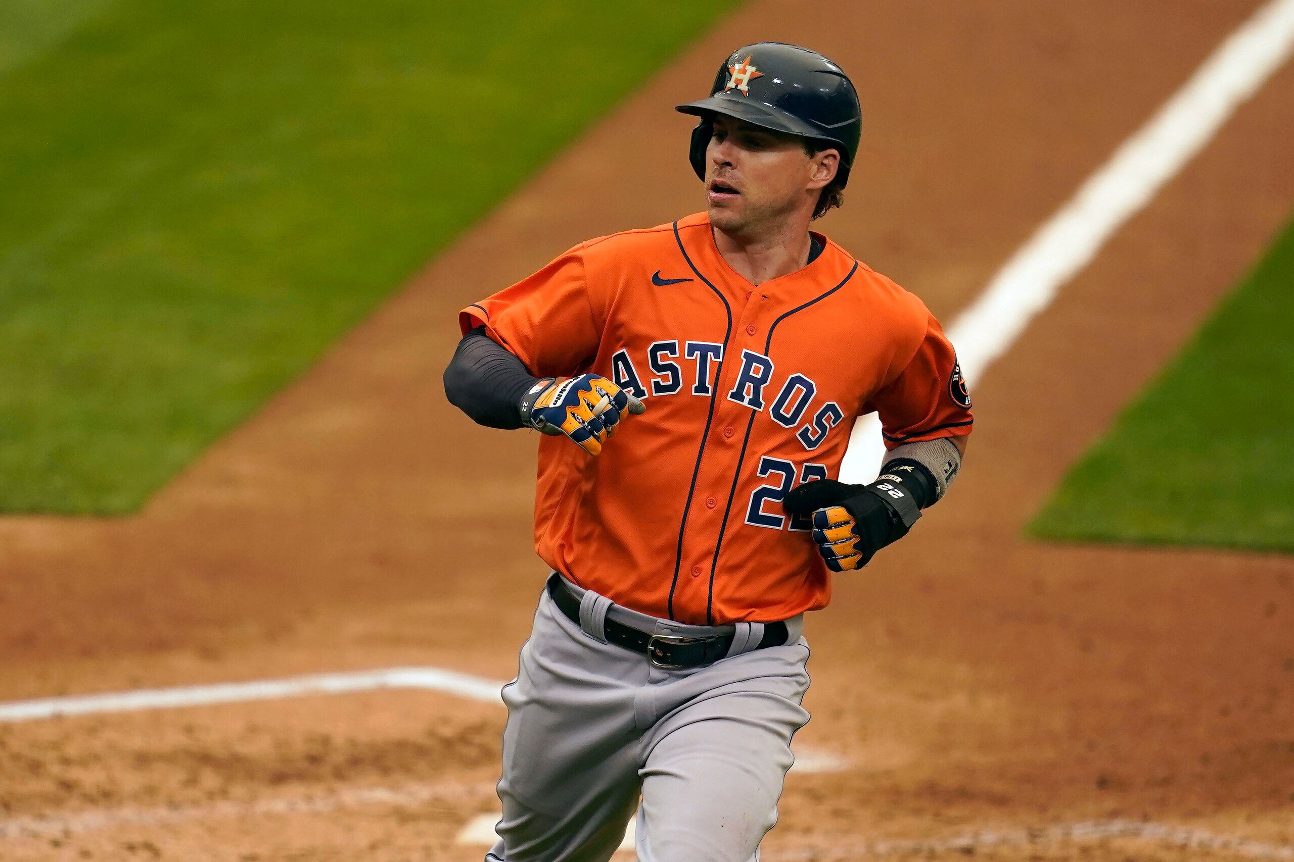 Houston Astros' Josh Reddick scores against the Oakland Athletics during the sixth inning of a baseball game in Oakland, Calif., Thursday, Sept. 10, 2020. (AP Photo/Jeff Chiu)