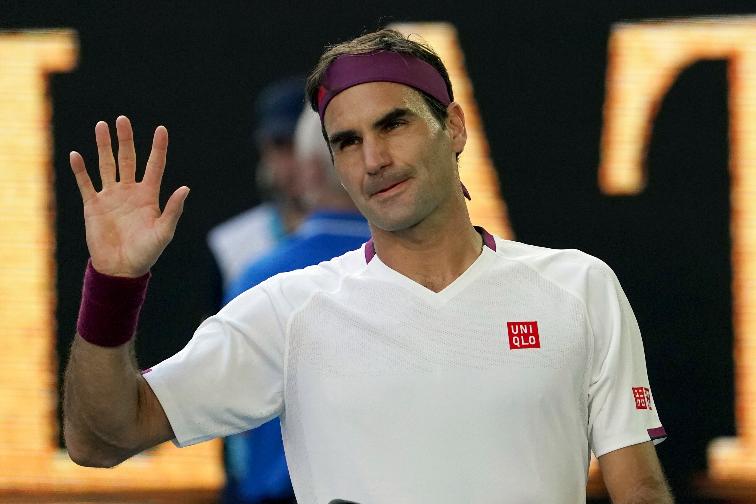 FILE- In this Jan. 28, 2020, file photo, Switzerland's Roger Federer waves after defeating Tennys Sandgren, of the United States, in their quarterfinal match at the Australian Open tennis championship in Melbourne, Australia. Federer is back on tour after more than a year away. (AP Photo/Lee Jin-man, File)