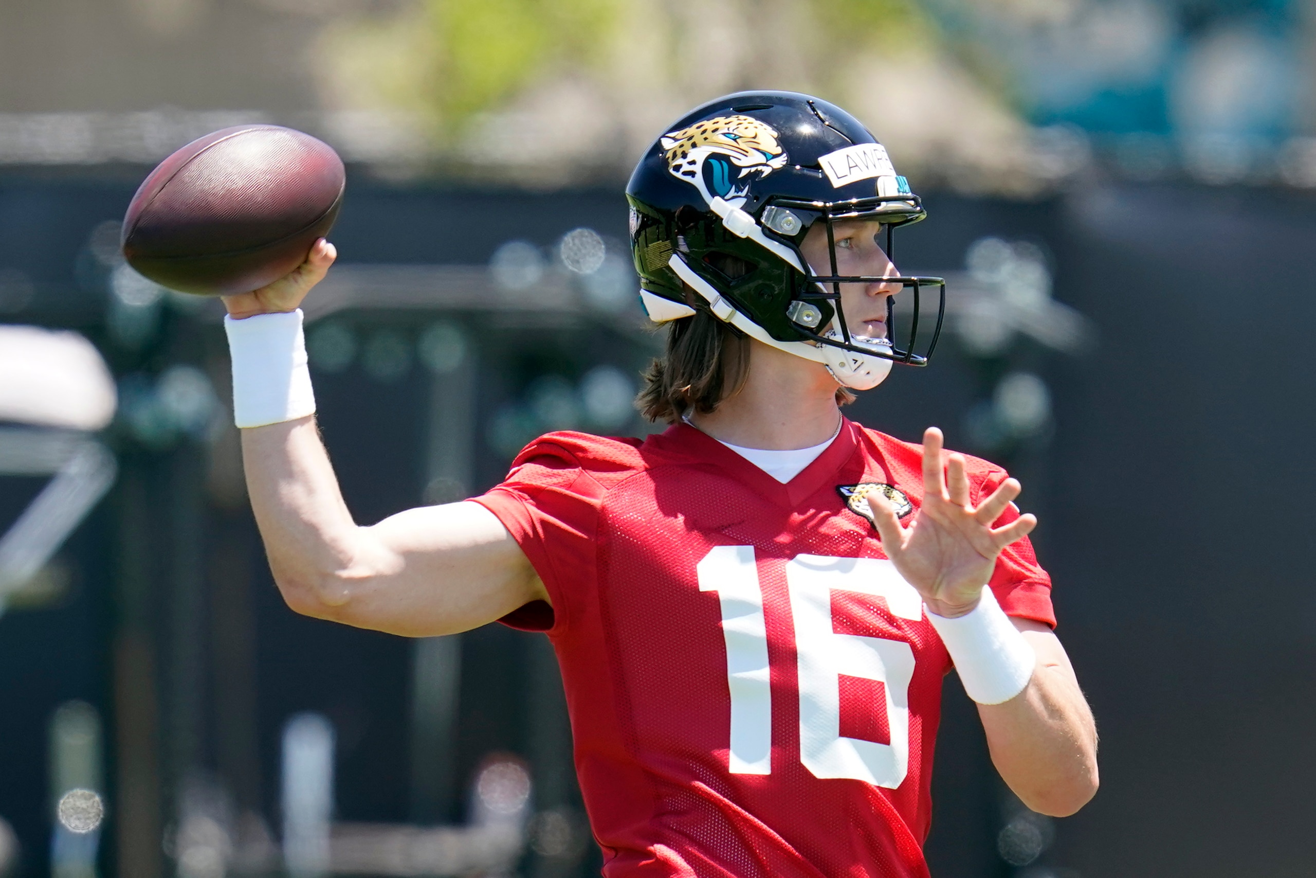 Jacksonville Jaguars quarterback Trevor Lawrence throws a pass during an NFL football rookie minicamp, Saturday, May 15, 2021, in Jacksonville, Fla. (AP Photo/John Raoux)