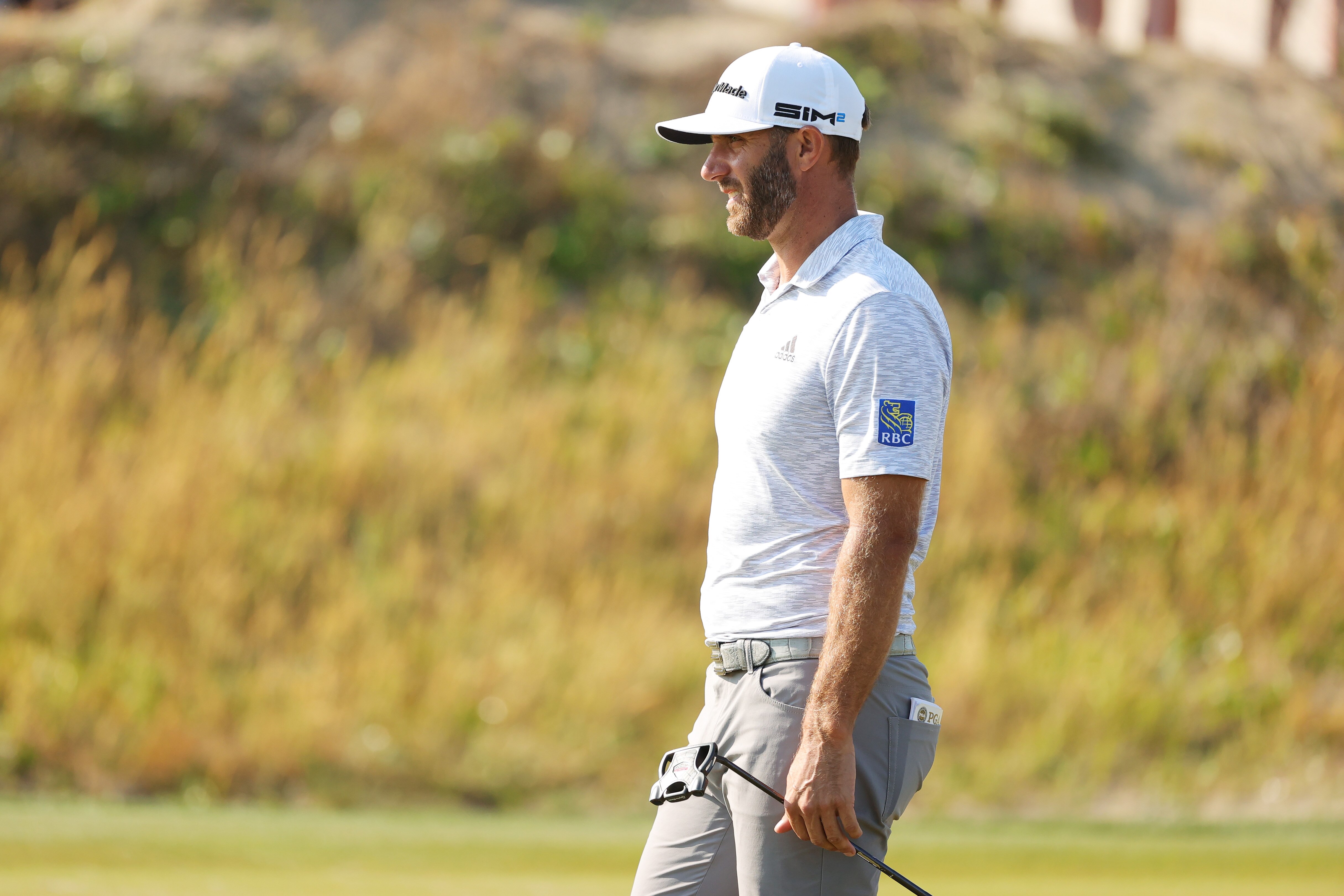 KIAWAH ISLAND, SOUTH CAROLINA - MAY 21: Dustin Johnson of the United States looks on from the tenth green during the second round of the 2021 PGA Championship at Kiawah Island Resort's Ocean Course on May 21, 2021 in Kiawah Island, South Carolina. (Photo by Stacy Revere/Getty Images)