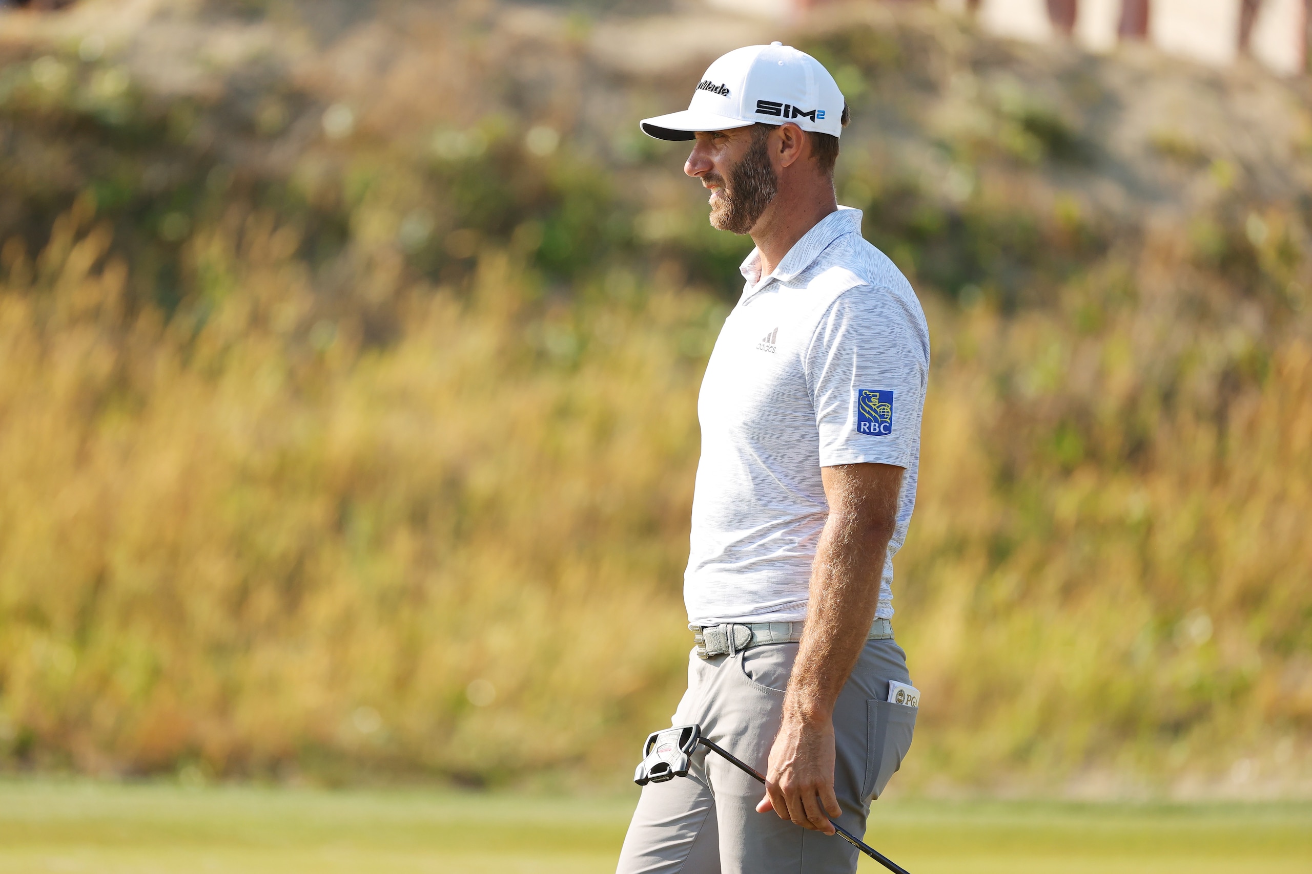 KIAWAH ISLAND, SOUTH CAROLINA - MAY 21: Dustin Johnson of the United States looks on from the tenth green during the second round of the 2021 PGA Championship at Kiawah Island Resort's Ocean Course on May 21, 2021 in Kiawah Island, South Carolina. (Photo by Stacy Revere/Getty Images)