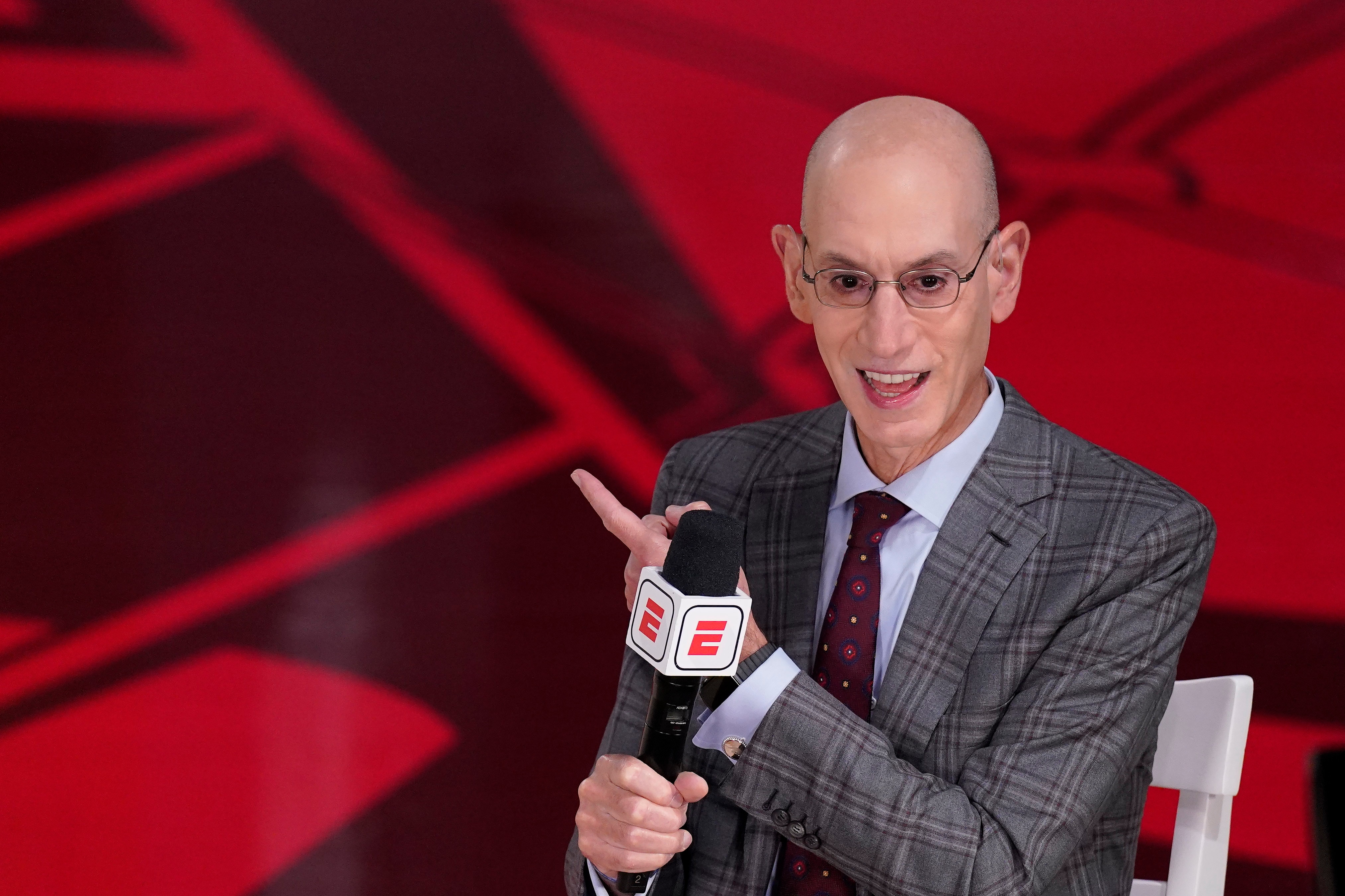 FILE - In this Oct. 4, 2020, file photo, NBA Commissioner Adam Silver does an interview before Game 3 of basketball's NBA Finals in Lake Buena Vista, Fla. Sports got taken down a notch in 2020. The lights went out in mid-March, soon after Silver flipped a circuit-breaker on the season. (AP Photo/Mark J. Terrill, File)