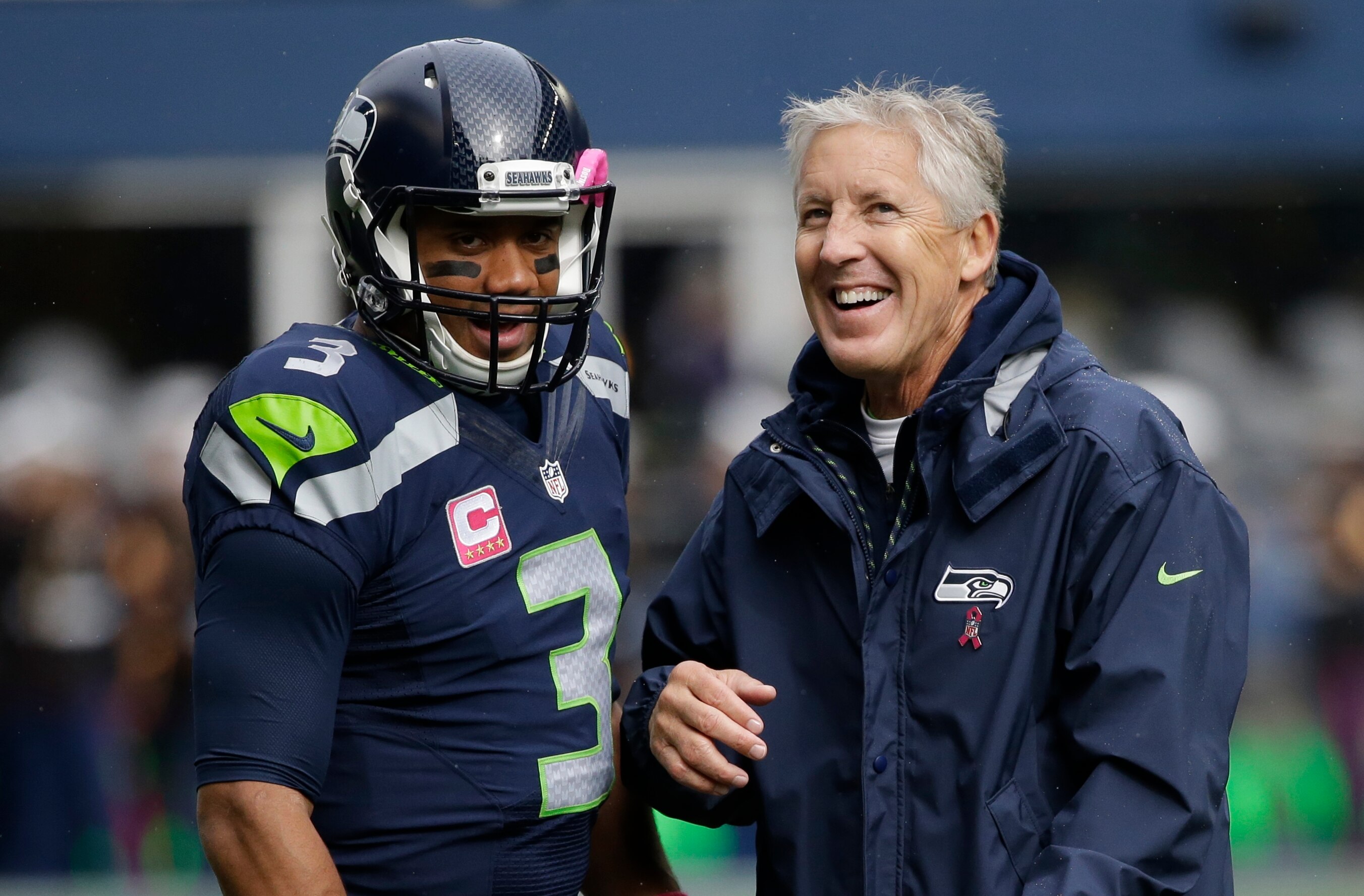 Seattle Seahawks quarterback Russell Wilson, left, talks with head coach Pete Carroll, right, before an NFL football game against the Atlanta Falcons, Sunday, Oct. 16, 2016, in Seattle. (AP Photo/Elaine Thompson) Seattle Seahawks quarterback Russell Wilson, left, talks with head coach Pete Carroll, right, before an NFL football game against the Atlanta Falcons, Sunday, Oct. 16, 2016, in Seattle. (AP Photo/Elaine Thompson)