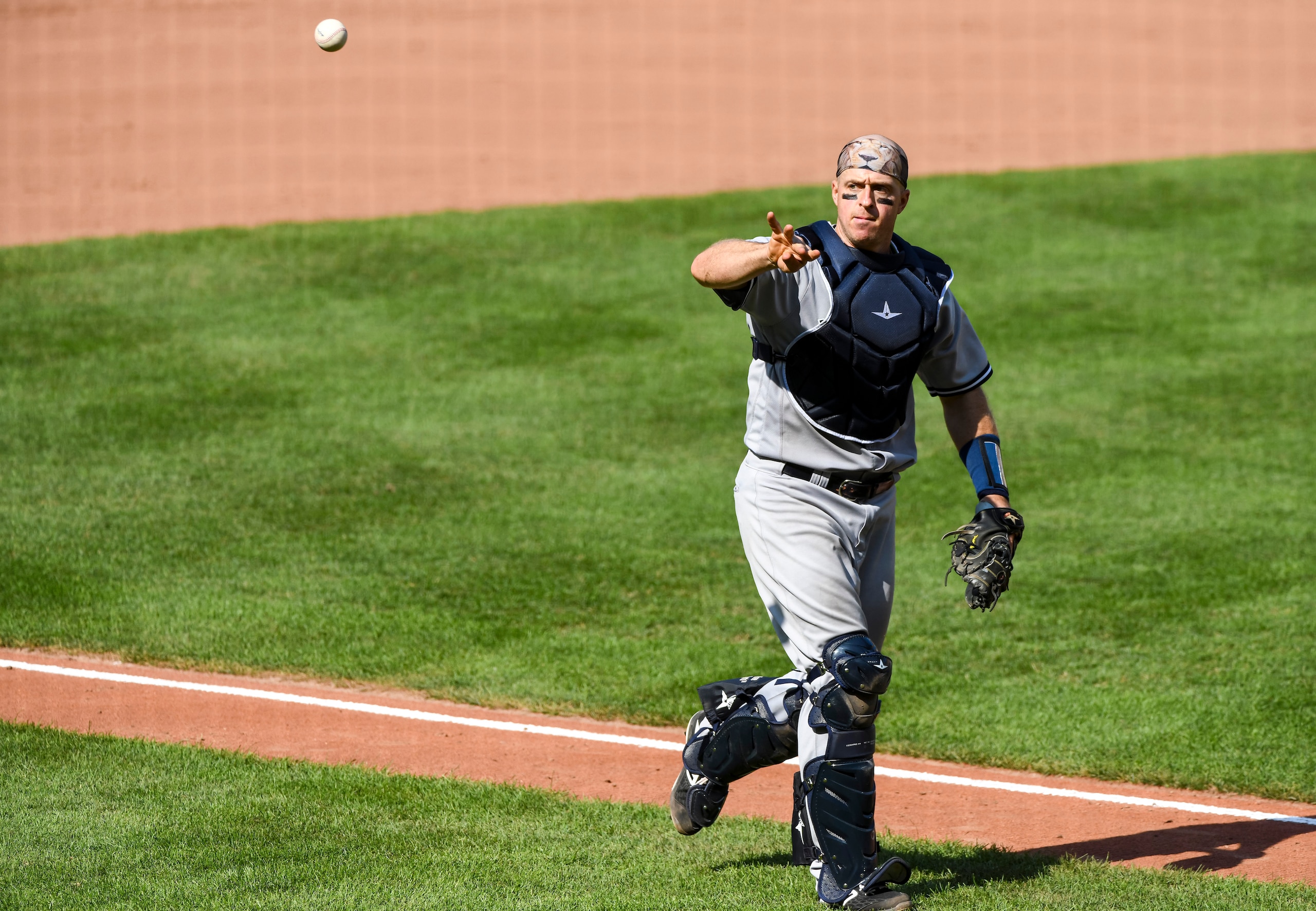 BALTIMORE, MD - SEPTEMBER 06:  New York Yankees catcher Erik Kratz (38) tosses a foul ball out of play during the game against the Baltimore Orioles on September 6, 2020, at Orioles Park at Camden Yards, in Baltimore, MD.  (Photo by Mark Goldman/Icon Sportswire via Getty Images)