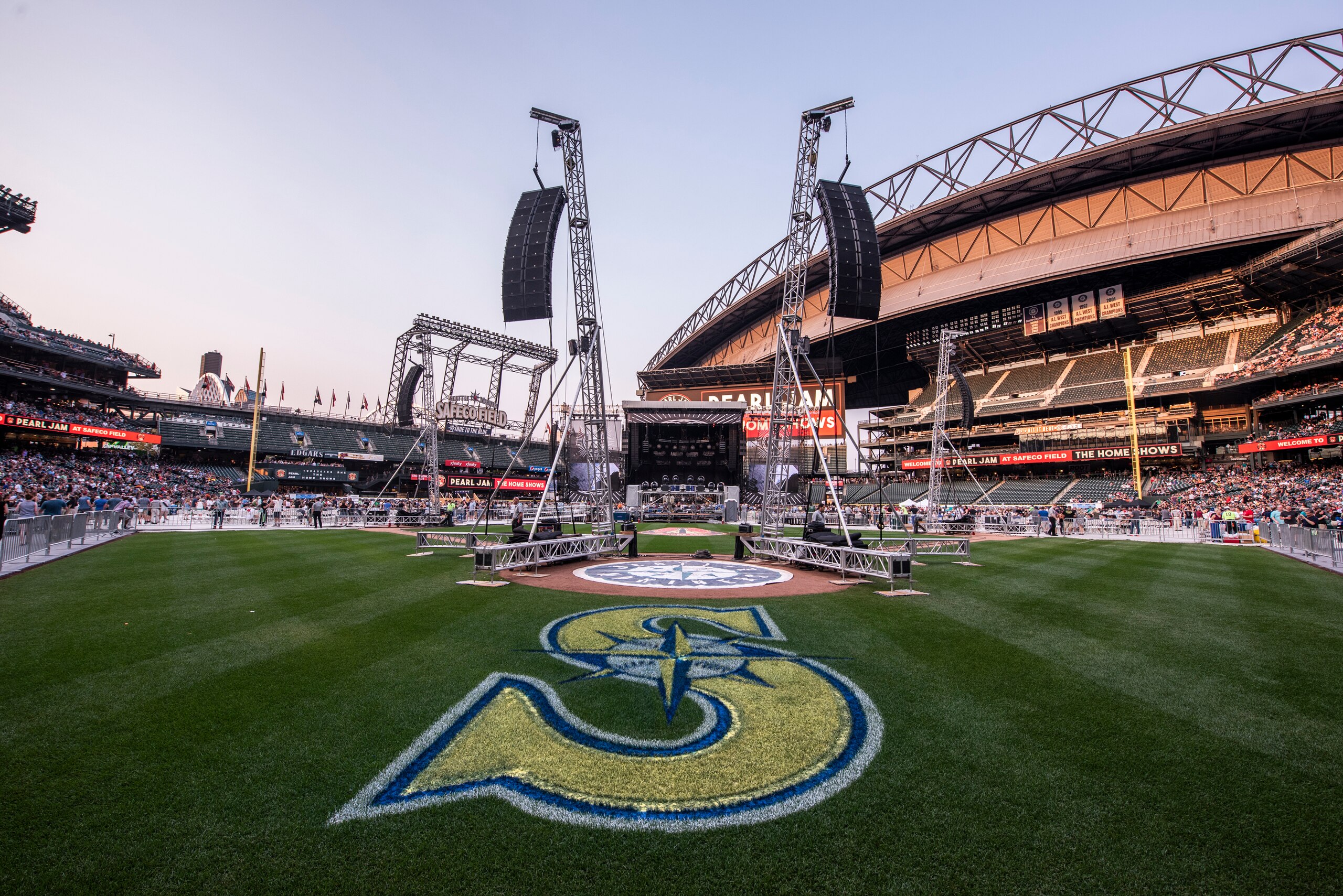 SEATTLE, WA - AUGUST 08:  The Mariners logo is displayed on the infield grass alongside speaker towers before Pearl Jam's performance starts at Safeco Field on August 8, 2018 in Seattle, Washington.  (Photo by Jim Bennett/Getty Images)