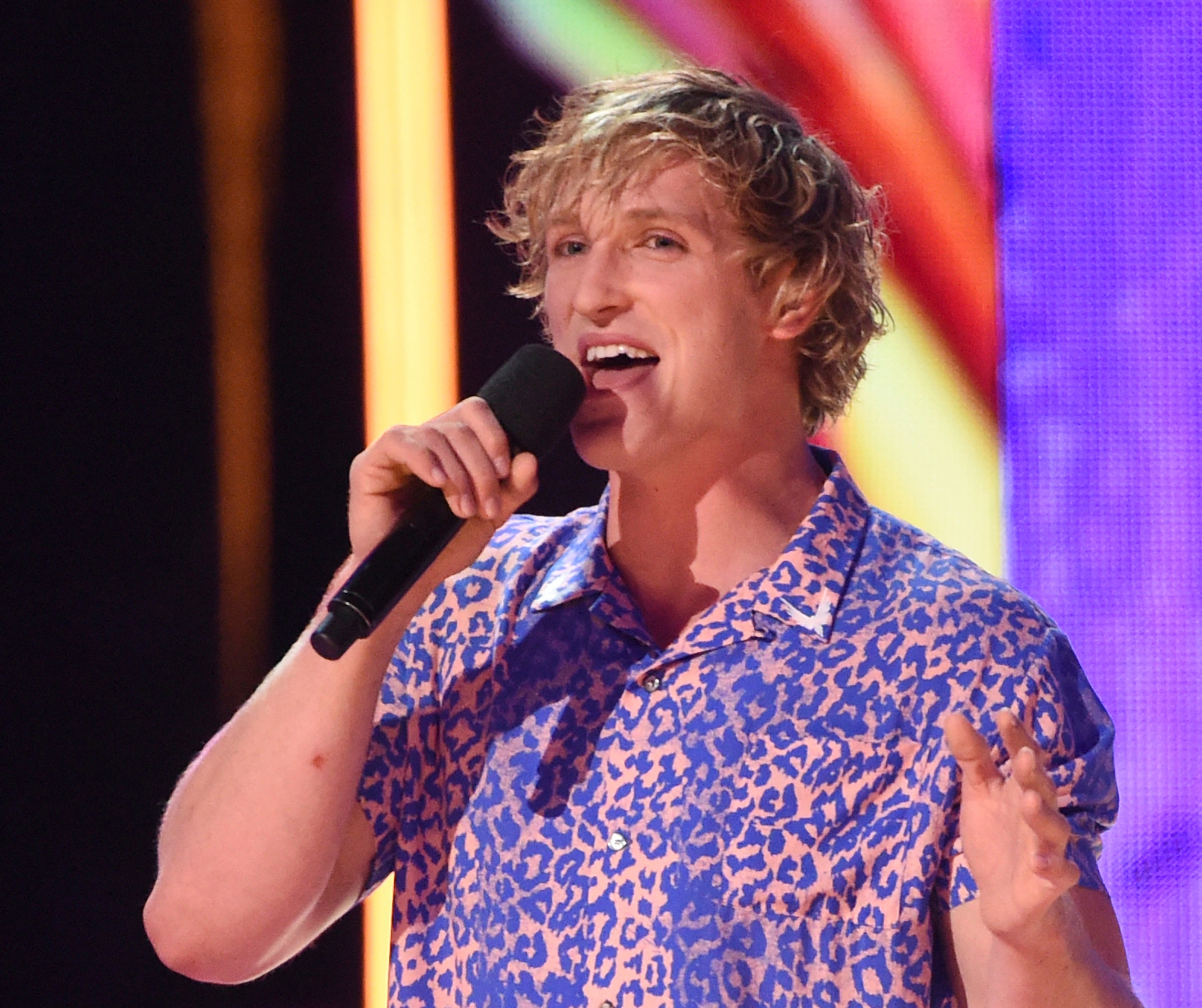 FILE - In this Aug. 13, 2017 file photo, Logan Paul speaks at the Teen Choice Awards at the Galen Center in Los Angeles. YouTube has temporarily suspended all ads from Paul’s channels after what it calls a pattern of behavior unsuitable for advertisers. An email sent to Paul’s merchandise company for comment was not immediately answered Friday, Feb. 9, 2018. (Photo by Phil McCarten/Invision/AP, File)