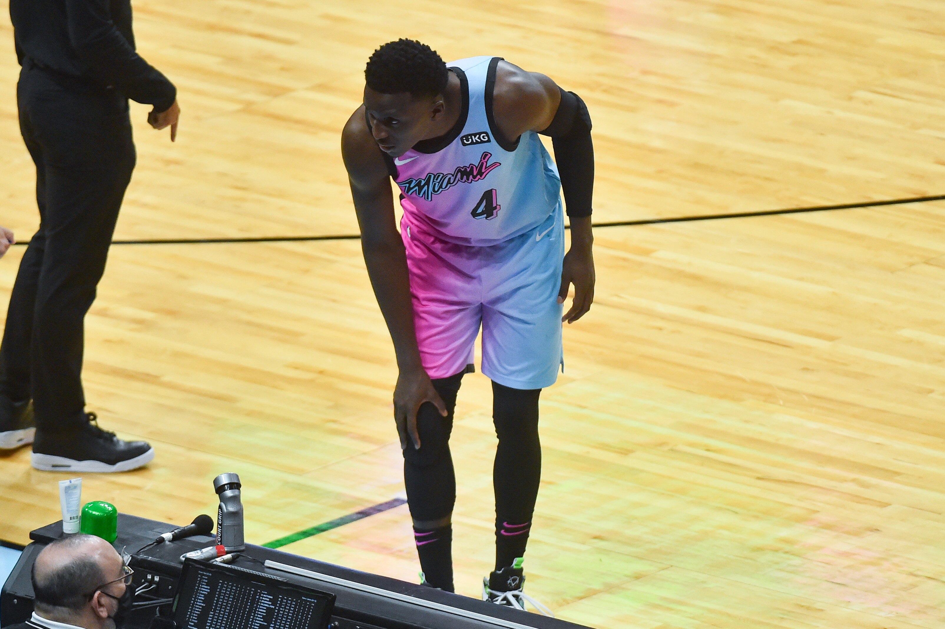 MIAMI, FL - APRIL 08: Victor Oladipo #4 of the Miami Heat holds his right knee after being injured in the second half against the Los Angeles Lakers at American Airlines Arena on April 8, 2021 in Miami, Florida.  NOTE TO USER: User expressly acknowledges and agrees that,  by downloading and or using this photograph,  User is consenting to the terms and conditions of the Getty Images License Agreement.(Photo by Eric Espada/Getty Images)