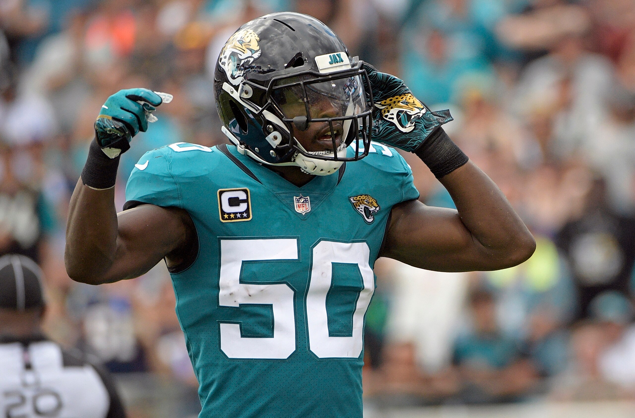 FILE - In this Sept. 16, 2018, file photo, Jacksonville Jaguars linebacker Telvin Smith (50) gestures to fans during the first half of an NFL football game against the New England Patriots in Jacksonville, Fla. Smith, the team’s leading tackler the last two seasons and a Pro Bowl selection in 2017, is stepping away from football to “give this time back to myself, my family & my health.” (AP Photo/Phelan M. Ebenhack, File)