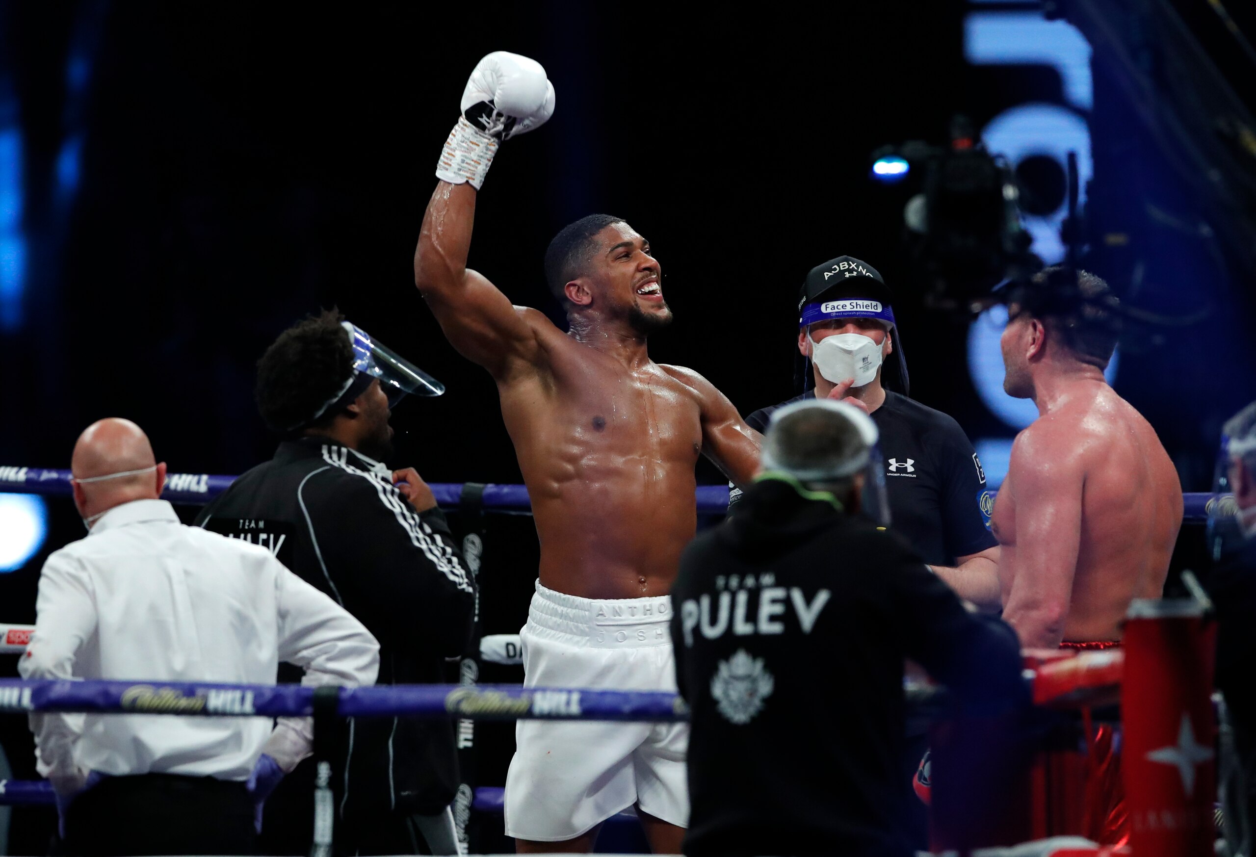 World Heavyweight boxing champion Britain's Anthony Joshua celebrates after beating challenger Bulgaria's Kubrat Pulev in their Heavyweight title fight at Wembley Arena in London Saturday, Dec. 12, 2020. (Andrew Couldridge/Pool via AP)
