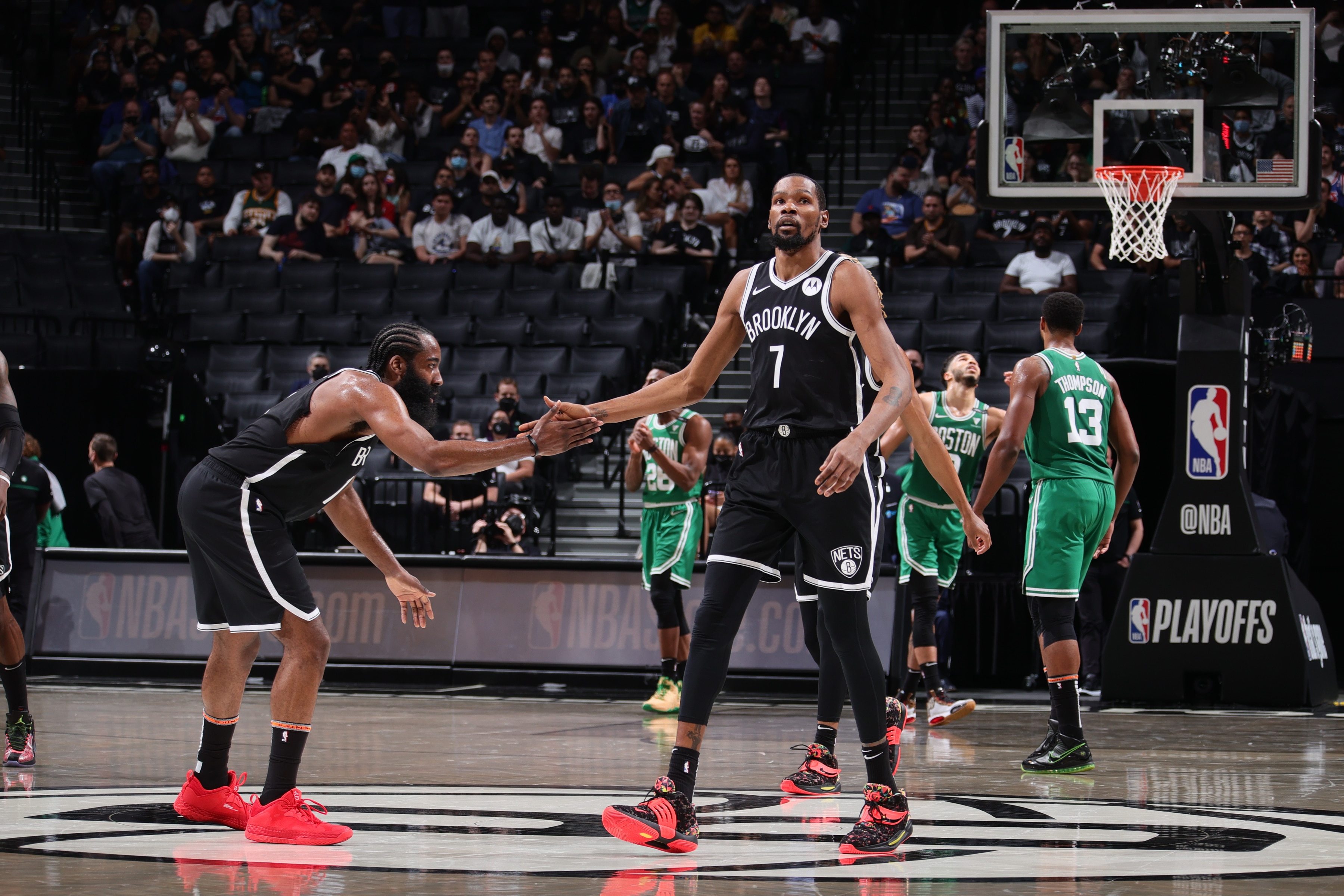 BROOKLYN, NY -  MAY 22: James Harden #13 and Kevin Durant #7 of the Brooklyn Nets high five during Round 1, Game 1 of the 2021 NBA Playoffs on May 22, 2021 at Barclays Center in Brooklyn, New York. NOTE TO USER: User expressly acknowledges and agrees that, by downloading and or using this Photograph, user is consenting to the terms and conditions of the Getty Images License Agreement. Mandatory Copyright Notice: Copyright 2021 NBAE (Photo by Nathaniel S. Butler/NBAE via Getty Images)