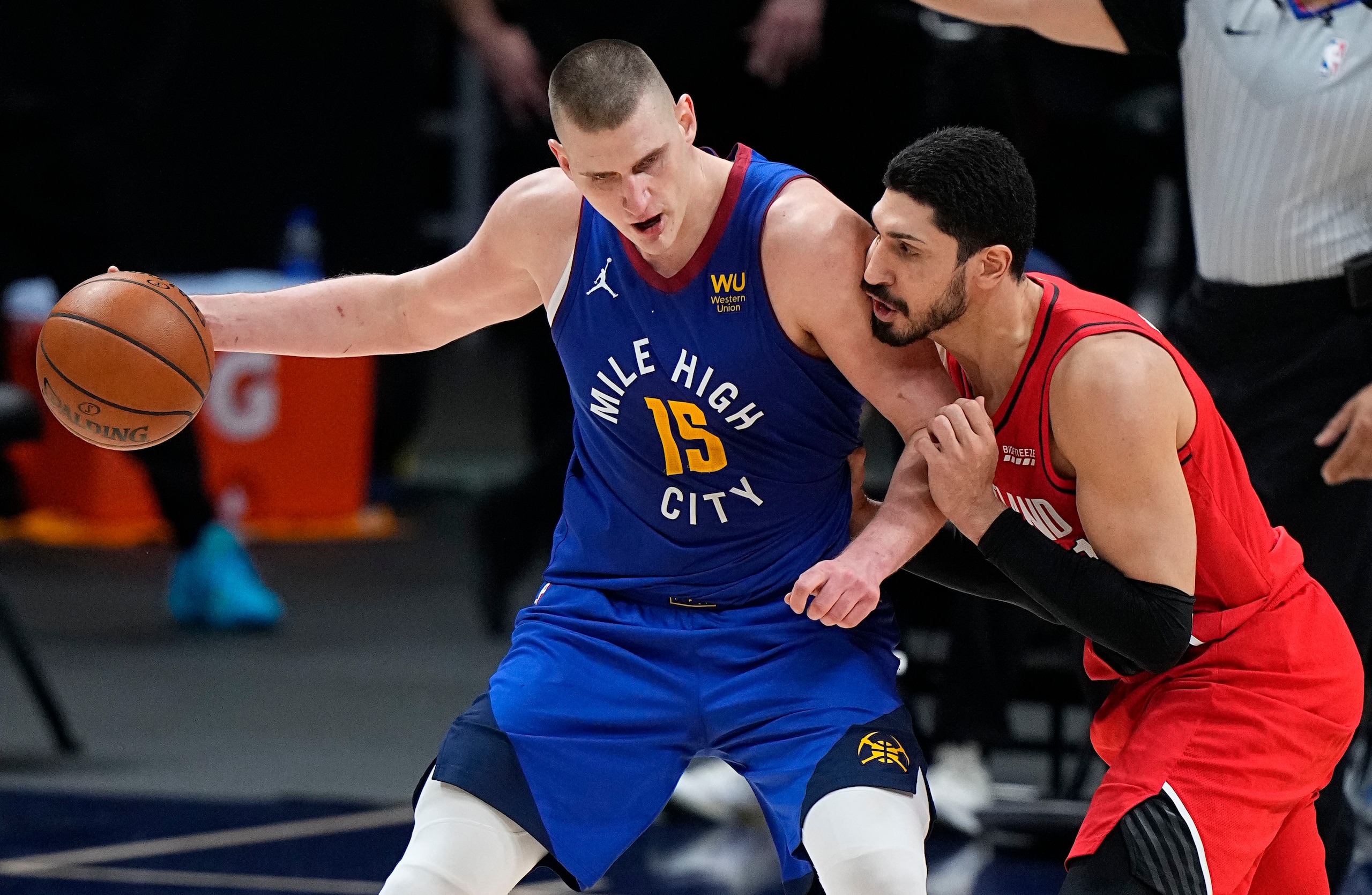 Denver Nuggets center Nikola Jokic (15) moves against Portland Trail Blazers center Enes Kanter (11) in the second half of Game 1 of a first-round NBA basketball playoff series Saturday, May 22, 2021, in Denver. (AP Photo/Jack Dempsey)