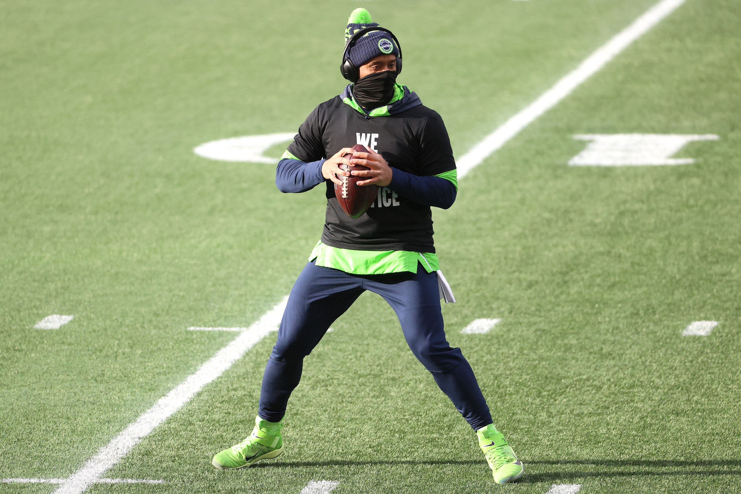 SEATTLE, WASHINGTON - JANUARY 09: Russell Wilson #3 of the Seattle Seahawks warms up before the NFC Wild Card Playoff game against the Los Angeles Rams at Lumen Field on January 09, 2021 in Seattle, Washington. (Photo by Abbie Parr/Getty Images) SEATTLE, WASHINGTON - JANUARY 09: Russell Wilson #3 of the Seattle Seahawks warms up before the NFC Wild Card Playoff game against the Los Angeles Rams at Lumen Field on January 09, 2021 in Seattle, Washington. (Photo by Abbie Parr/Getty Images)