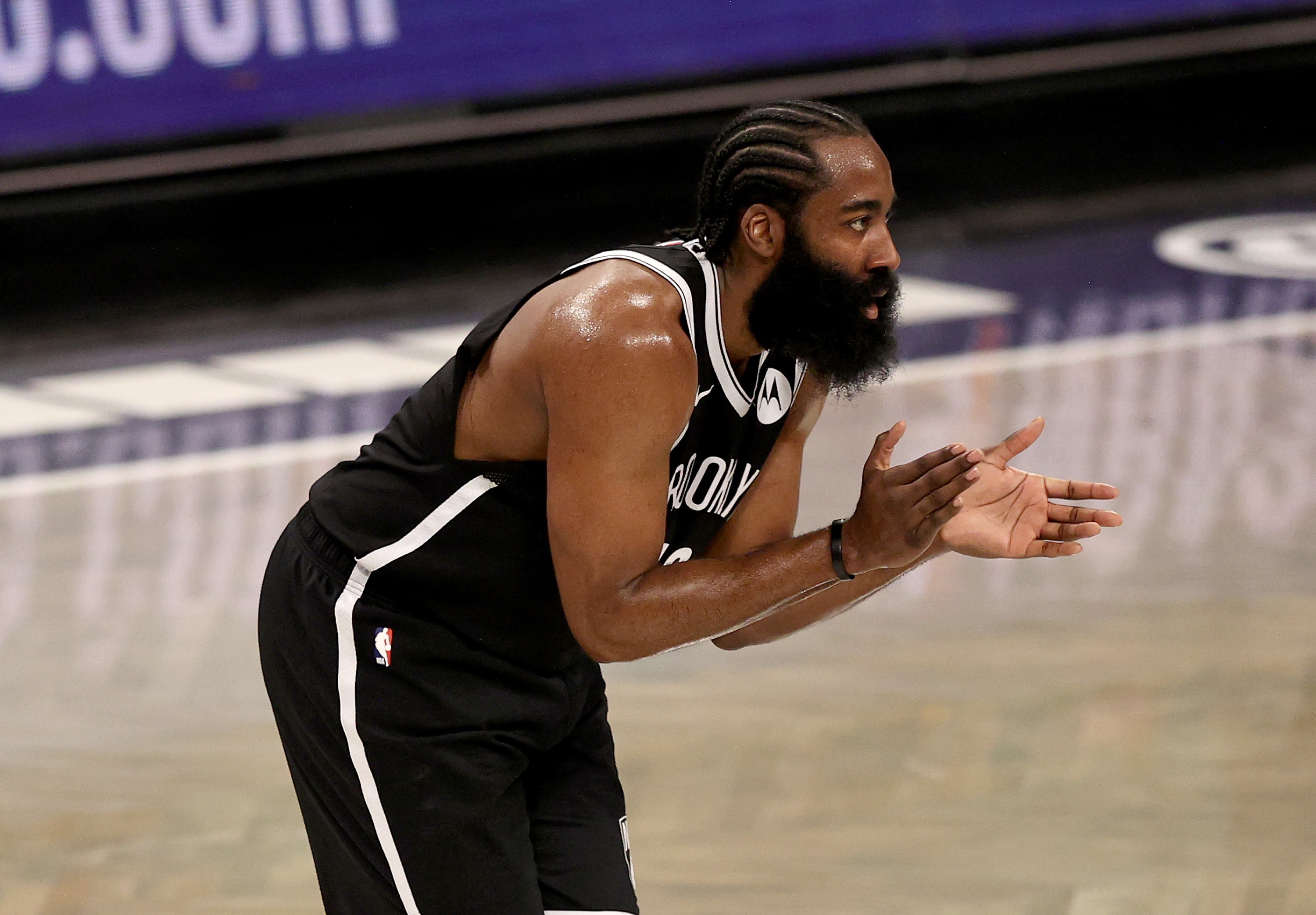 NEW YORK, NEW YORK - MAY 22: James Harden #13 of the Brooklyn Nets encourages his teammates in the second quarter against the Boston Celtics during Game One of their Eastern Conference first-round playoff series on May 22, 2021 at Barclays Center in the Brooklyn borough of New York City. NOTE TO USER: User expressly acknowledges and agrees that, by downloading and or using this photograph, User is consenting to the terms and conditions of the Getty Images License Agreement. (Photo by Elsa/Getty Images)