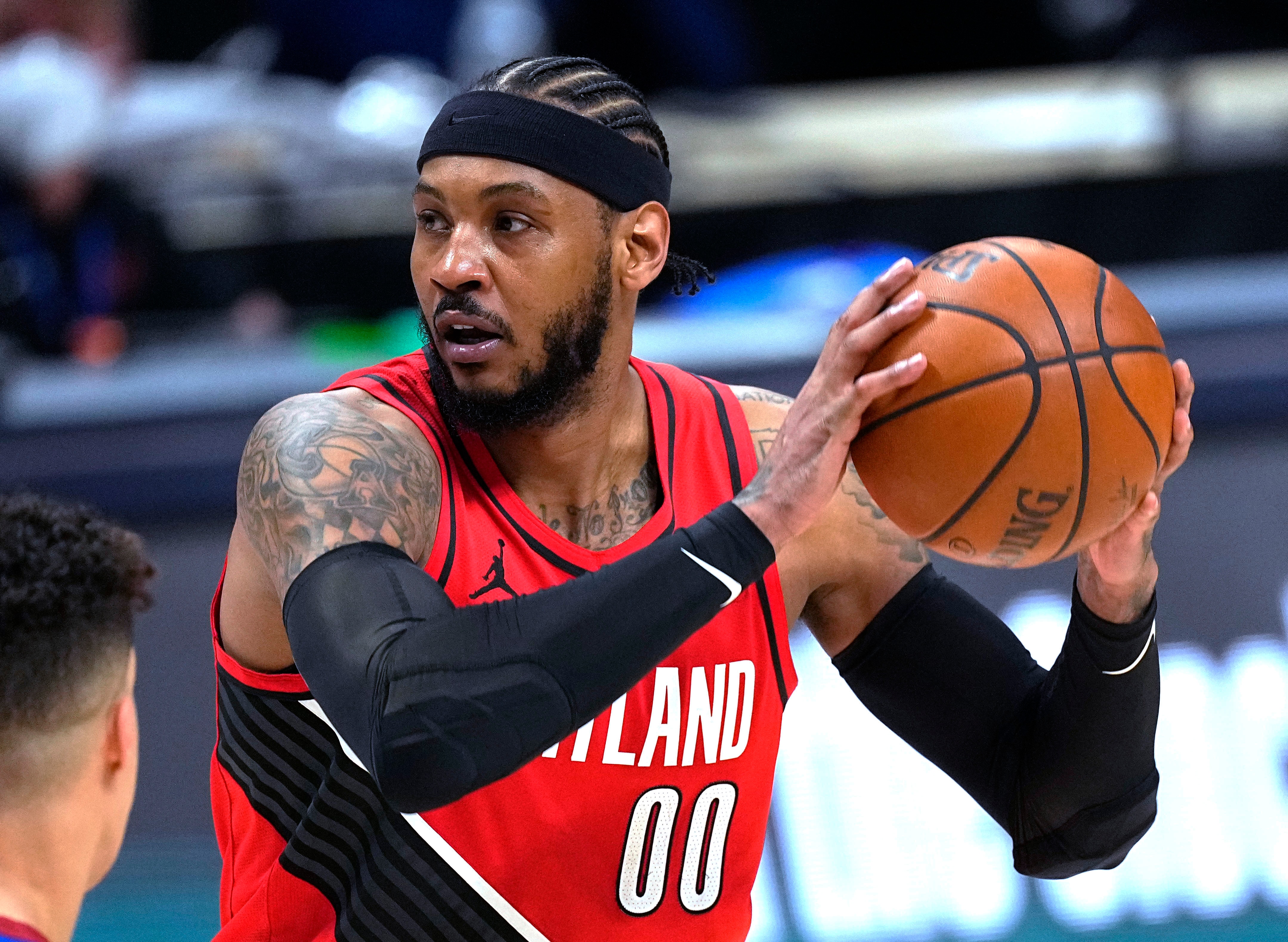 Portland Trail Blazers forward Carmelo Anthony (00) looks to pass the ball against the Denver Nuggets during the second half of Game 1 of a first-round NBA basketball playoff series Saturday, May 22, 2021, in Denver. (AP Photo/Jack Dempsey)