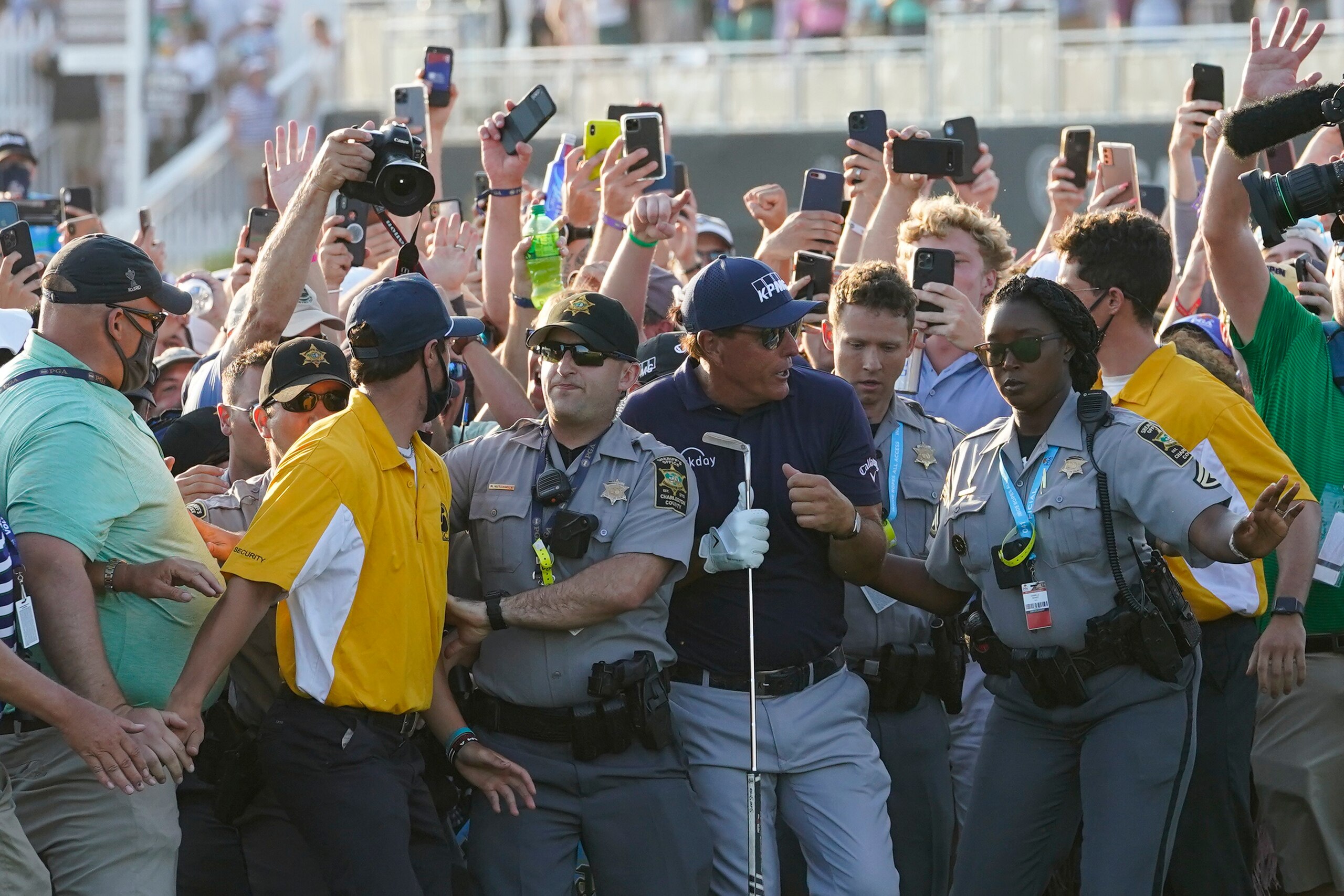 Phil Mickelson wades through fans on the 18th fairway during the final round at the PGA Championship golf tournament on the Ocean Course, Sunday, May 23, 2021, in Kiawah Island, S.C. (AP Photo/Matt York) Phil Mickelson wades through fans on the 18th fairway during the final round at the PGA Championship golf tournament on the Ocean Course, Sunday, May 23, 2021, in Kiawah Island, S.C. (AP Photo/Matt York)