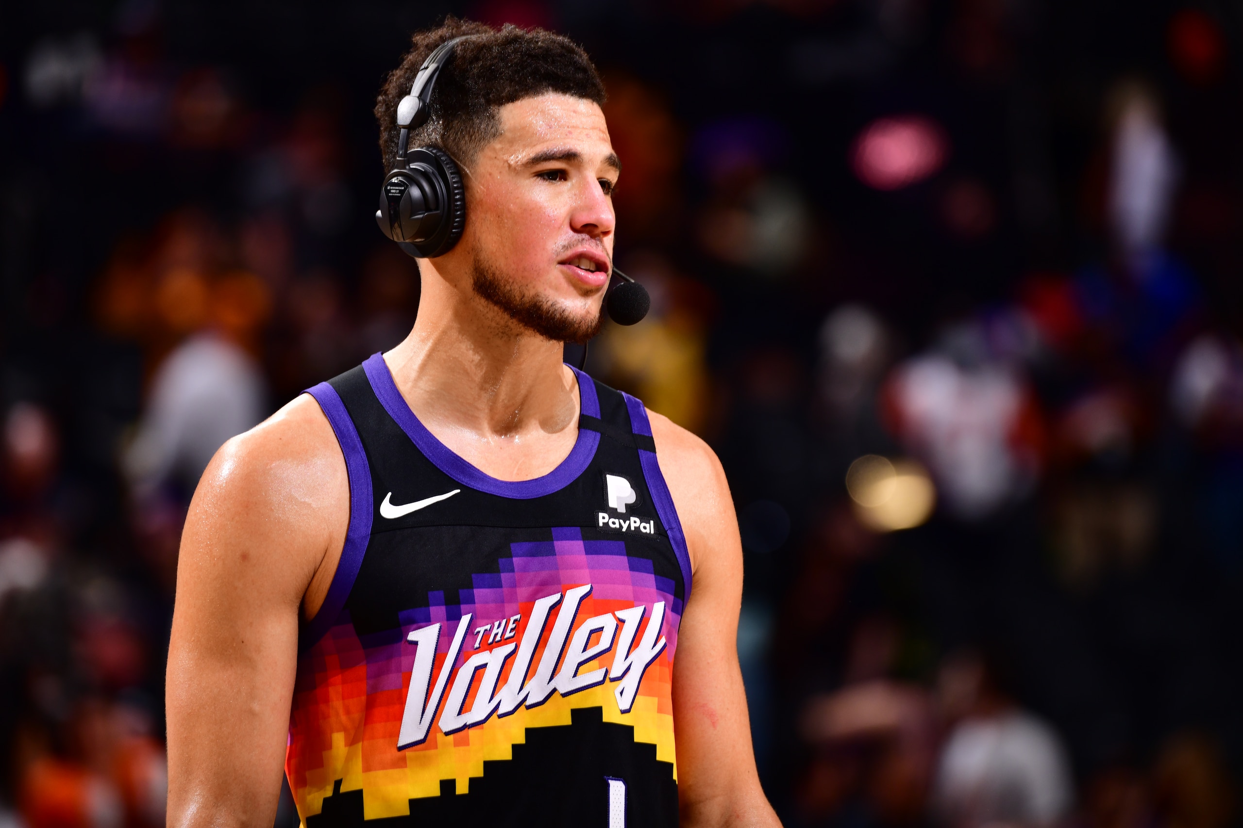 PHOENIX, AZ - MAY 23: Devin Booker #1 of the Phoenix Suns is interviewed after the game against the Los Angeles Lakers during Round 1, Game 1 of the 2021 NBA Playoffs on May 23, 2021 at Talking Stick Resort Arena in Phoenix, Arizona. NOTE TO USER: User expressly acknowledges and agrees that, by downloading and or using this photograph, user is consenting to the terms and conditions of the Getty Images License Agreement. Mandatory Copyright Notice: Copyright 2021 NBAE (Photo by Barry Gossage/NBAE via Getty Images)