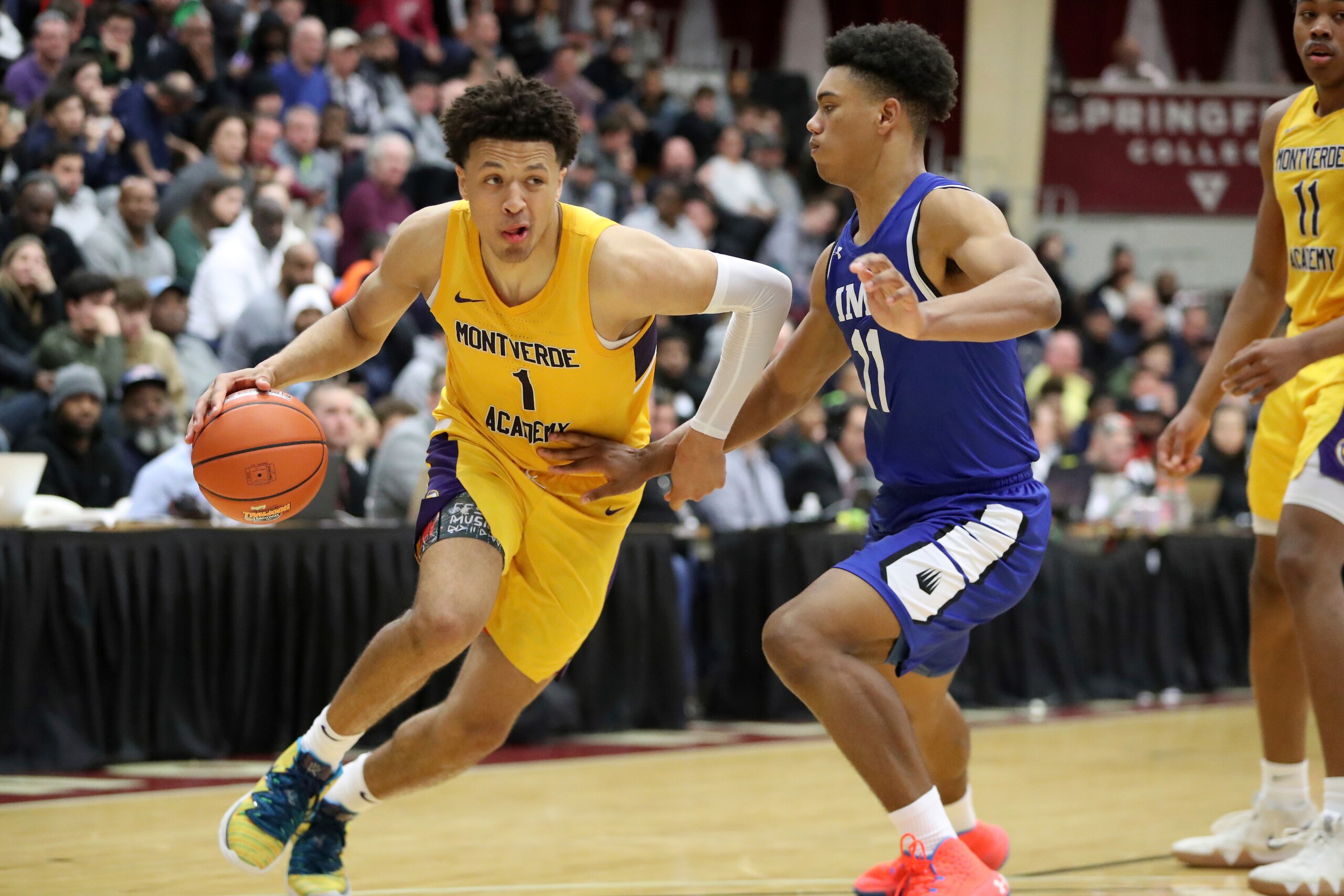 FILE - In this Jan. 19, 2020, file photo, then-Montverde Academy's Cade Cunningham (1) drives against an unidentified IMG Academy defender during a high school basketball game at the Hoophall Classic in Springfield, Mass. Oklahoma State could have a year to remember, even if it doesn’t end in the NCAA Tournament. Freshman point guard Cade Cunningham, a preseason Associated Press All-American, stayed at Oklahoma State despite the NCAA banning the Cowboys from postseason play this season. (AP Photo/Gregory Payan, File)