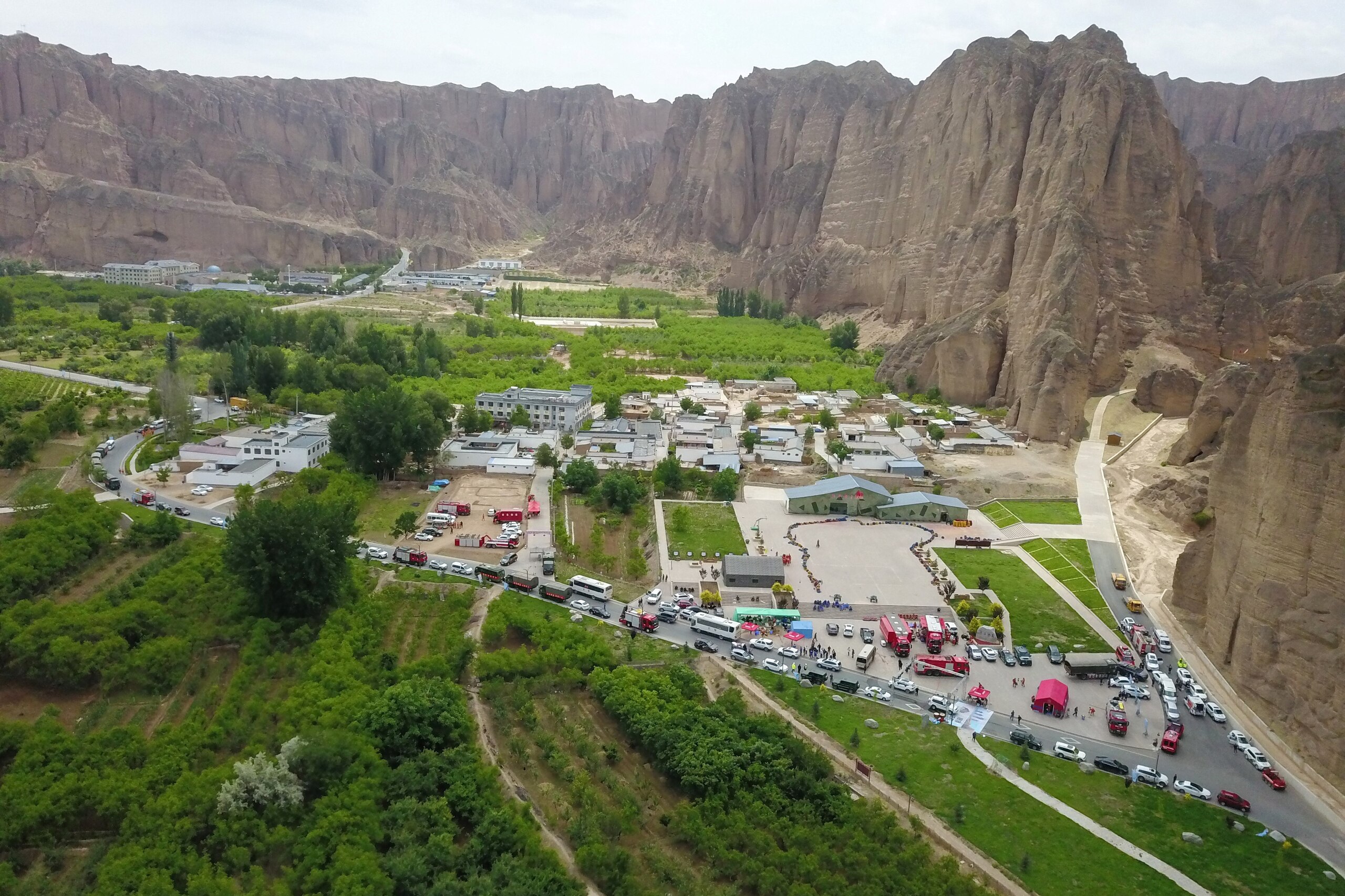This aerial photo taken on May 23, 2021 shows rescue vehicles preparing to leave after finishing search for runners who were competing in a 100-kilometre cross-country mountain race when extreme weather hit the area, leaving at least 20 dead, near the city of Baiyin, in China's northwestern Gansu province. - China OUT (Photo by STR / AFP) / China OUT (Photo by STR/AFP via Getty Images) This aerial photo taken on May 23, 2021 shows rescue vehicles preparing to leave after finishing search for runners who were competing in a 100-kilometre cross-country mountain race when extreme weather hit the area, leaving at least 20 dead, near the city of Baiyin, in China's northwestern Gansu province. - China OUT (Photo by STR / AFP) / China OUT (Photo by STR/AFP via Getty Images)