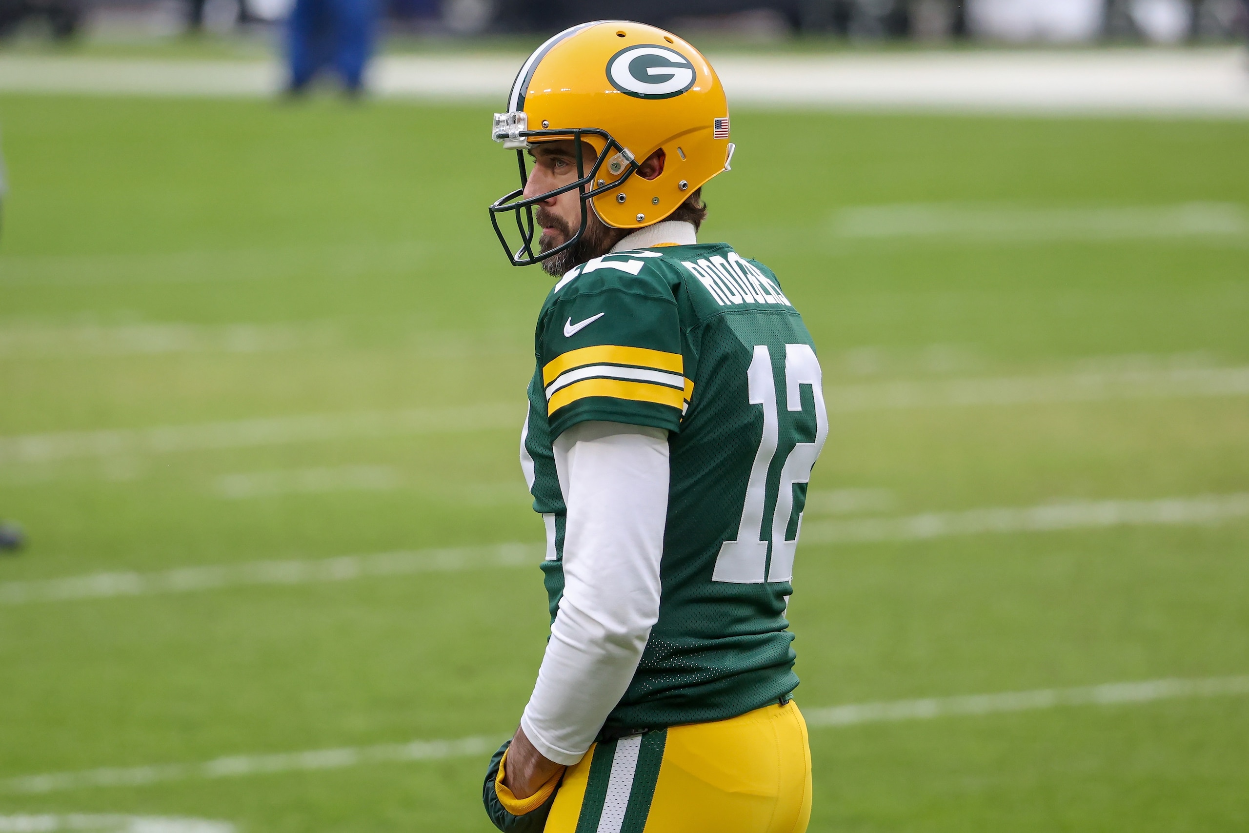 GREEN BAY, WISCONSIN - JANUARY 24: Aaron Rodgers #12 of the Green Bay Packers warms up before the NFC Championship game against the Tampa Bay Buccaneers at Lambeau Field on January 24, 2021 in Green Bay, Wisconsin. (Photo by Dylan Buell/Getty Images)