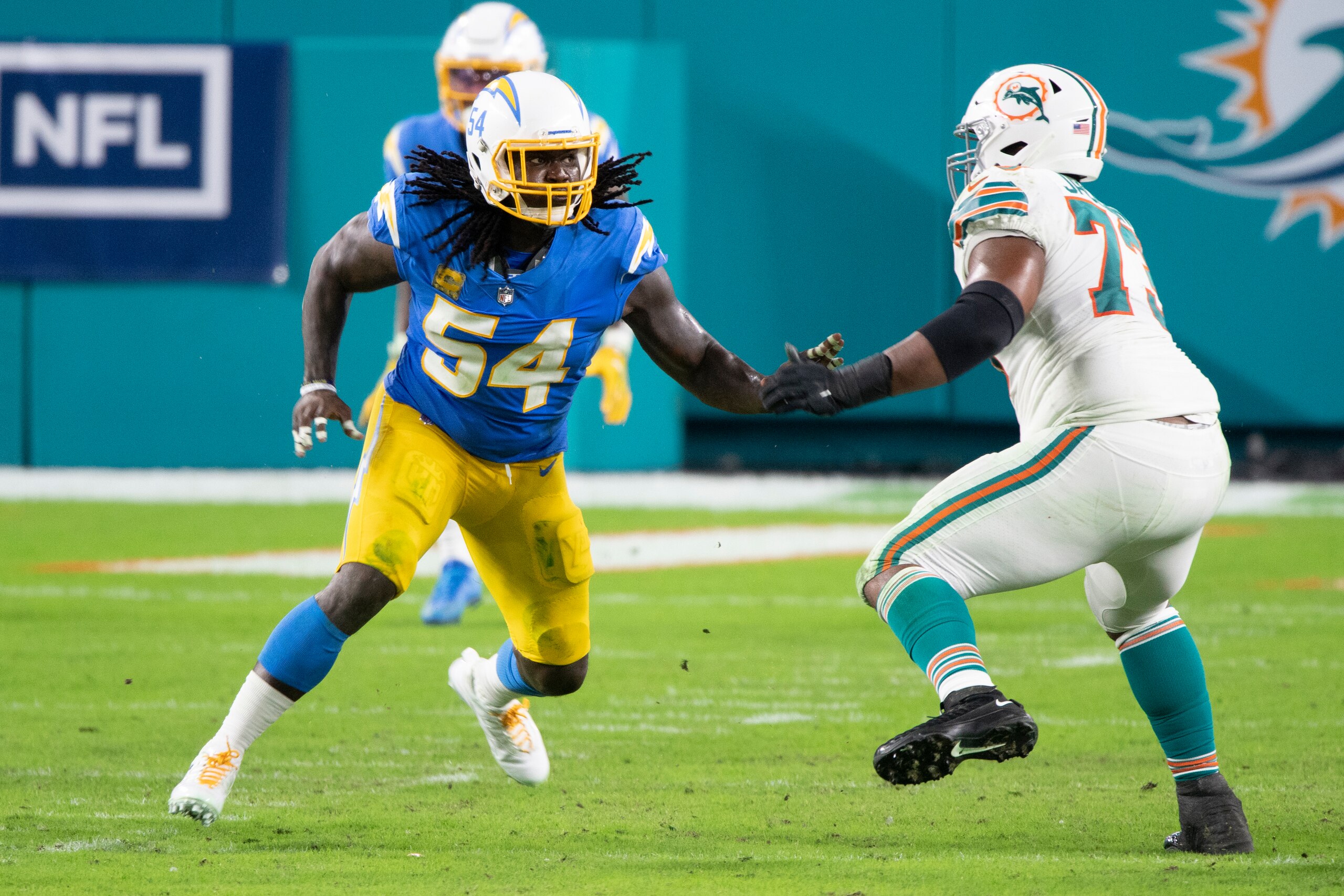 Miami Dolphins tackle Austin Jackson (73) blocks Los Angeles Chargers defensive end Melvin Ingram (54) during an NFL football game, Sunday, Nov. 15, 2020, in Miami Gardens, Fla. (AP Photo/Doug Murray)