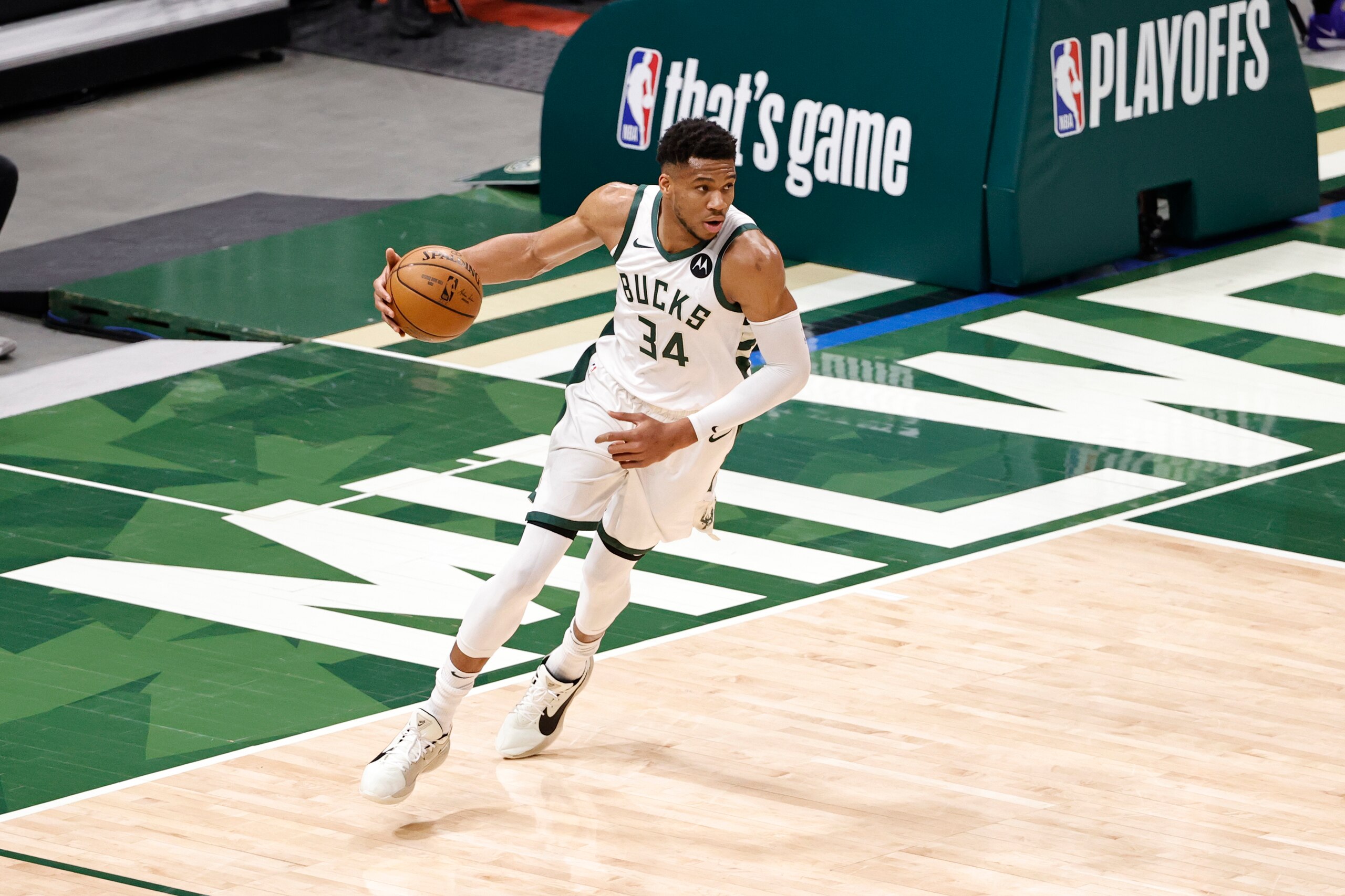 MILWAUKEE, WI - MAY 24: Giannis Antetokounmpo #34 of the Milwaukee Bucks dribbles the ball during the game against the Memphis Grizzlies during Round 1, Game 2 of the 2021 NBA Playoffs on May 24, 2021 at the Fiserv Forum Center in Milwaukee, Wisconsin. NOTE TO USER: User expressly acknowledges and agrees that, by downloading and or using this Photograph, user is consenting to the terms and conditions of the Getty Images License Agreement. Mandatory Copyright Notice: Copyright 2021 NBAE (Photo by Kamil Krzaczynski/NBAE via Getty Images).