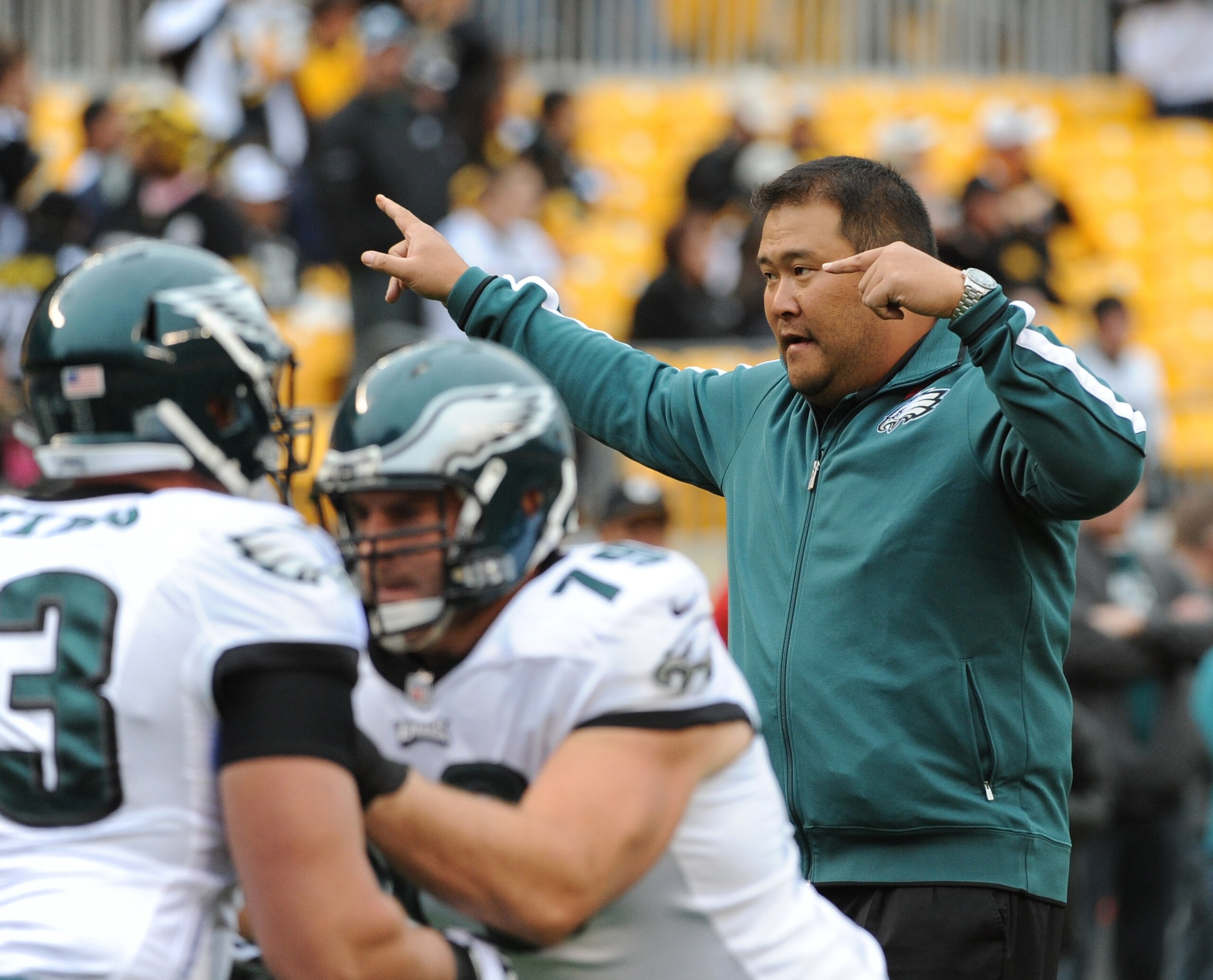PITTSBURGH, PA - OCTOBER 7: Offensive line assistant Eugene Chung of the Philadelphia Eagles directs players during pregame warmup prior to a game against the Pittsburgh Steelers at Heinz Field on October 7, 2012 in Pittsburgh, Pennsylvania. The Steelers defeated the Eagles 16-14. (Photo by George Gojkovich/Getty Images) PITTSBURGH, PA - OCTOBER 7: Offensive line assistant Eugene Chung of the Philadelphia Eagles directs players during pregame warmup prior to a game against the Pittsburgh Steelers at Heinz Field on October 7, 2012 in Pittsburgh, Pennsylvania. The Steelers defeated the Eagles 16-14. (Photo by George Gojkovich/Getty Images)