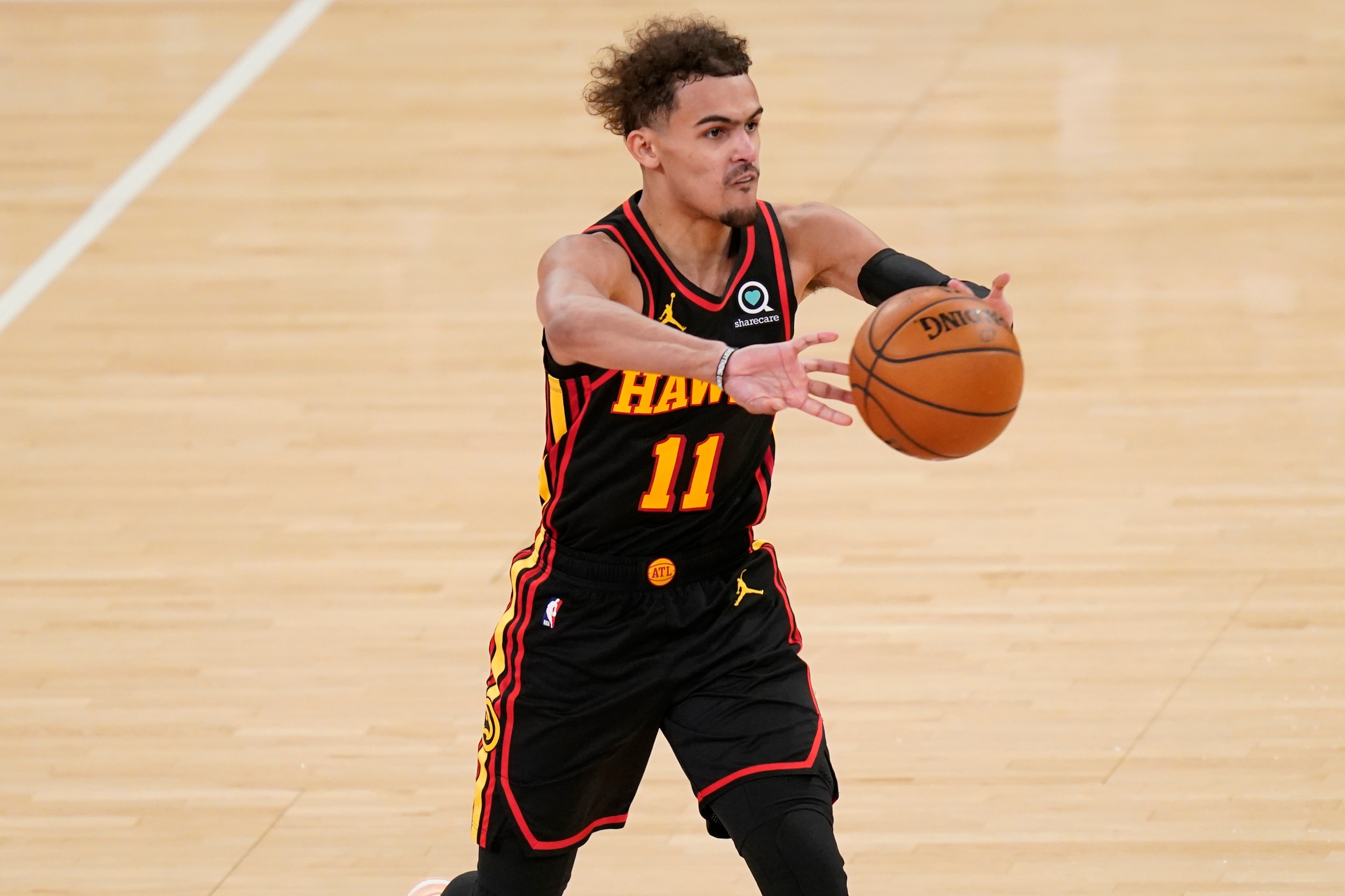 Atlanta Hawks' Trae Young passes during the second half of Game 1 of an NBA basketball first-round playoff series against the New York Knicks, Sunday, May 23, 2021, in New York. (AP Photo/Seth Wenig, Pool) Atlanta Hawks' Trae Young passes during the second half of Game 1 of an NBA basketball first-round playoff series against the New York Knicks, Sunday, May 23, 2021, in New York. (AP Photo/Seth Wenig, Pool)