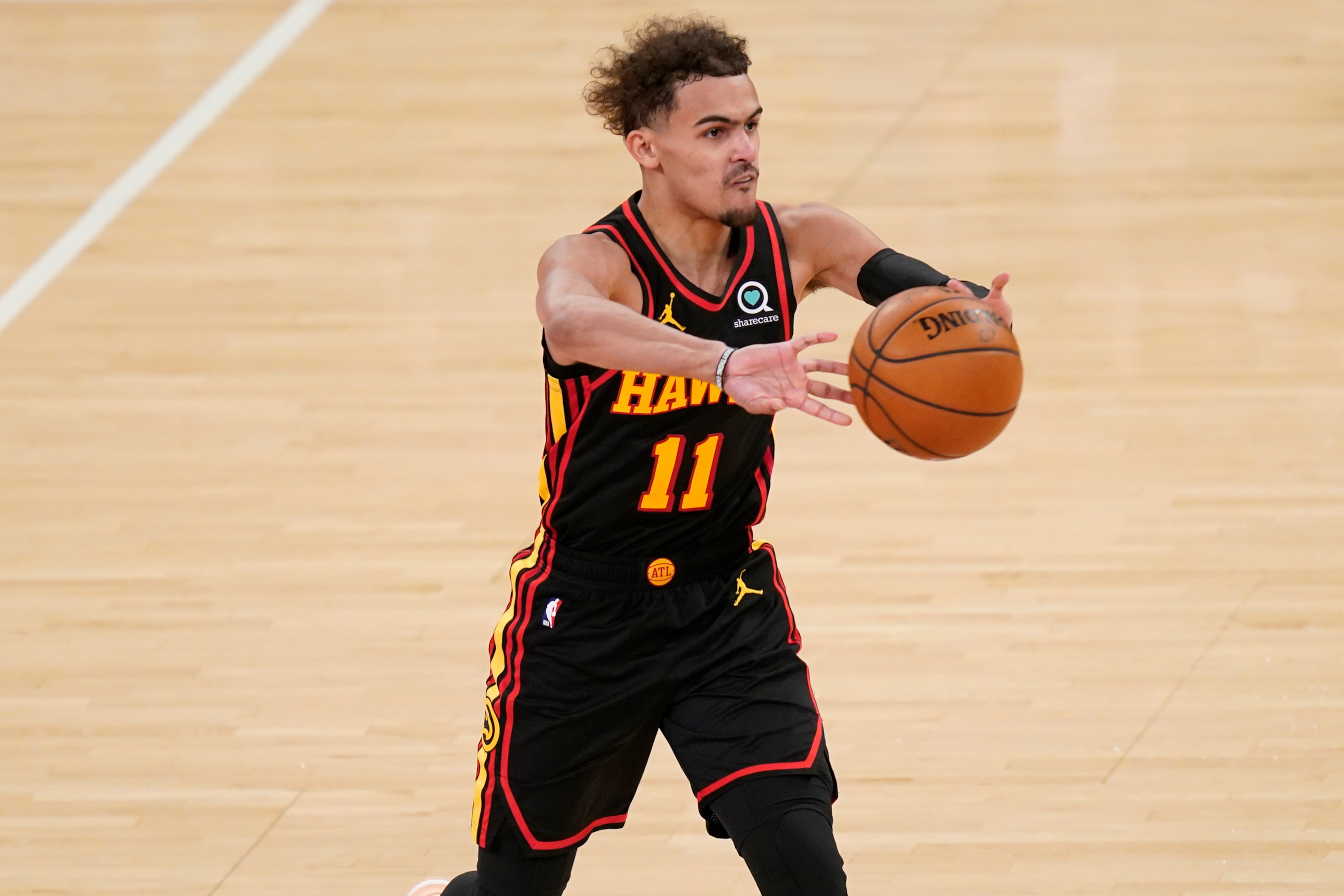 Atlanta Hawks' Trae Young passes during the second half of Game 1 of an NBA basketball first-round playoff series against the New York Knicks, Sunday, May 23, 2021, in New York. (AP Photo/Seth Wenig, Pool)