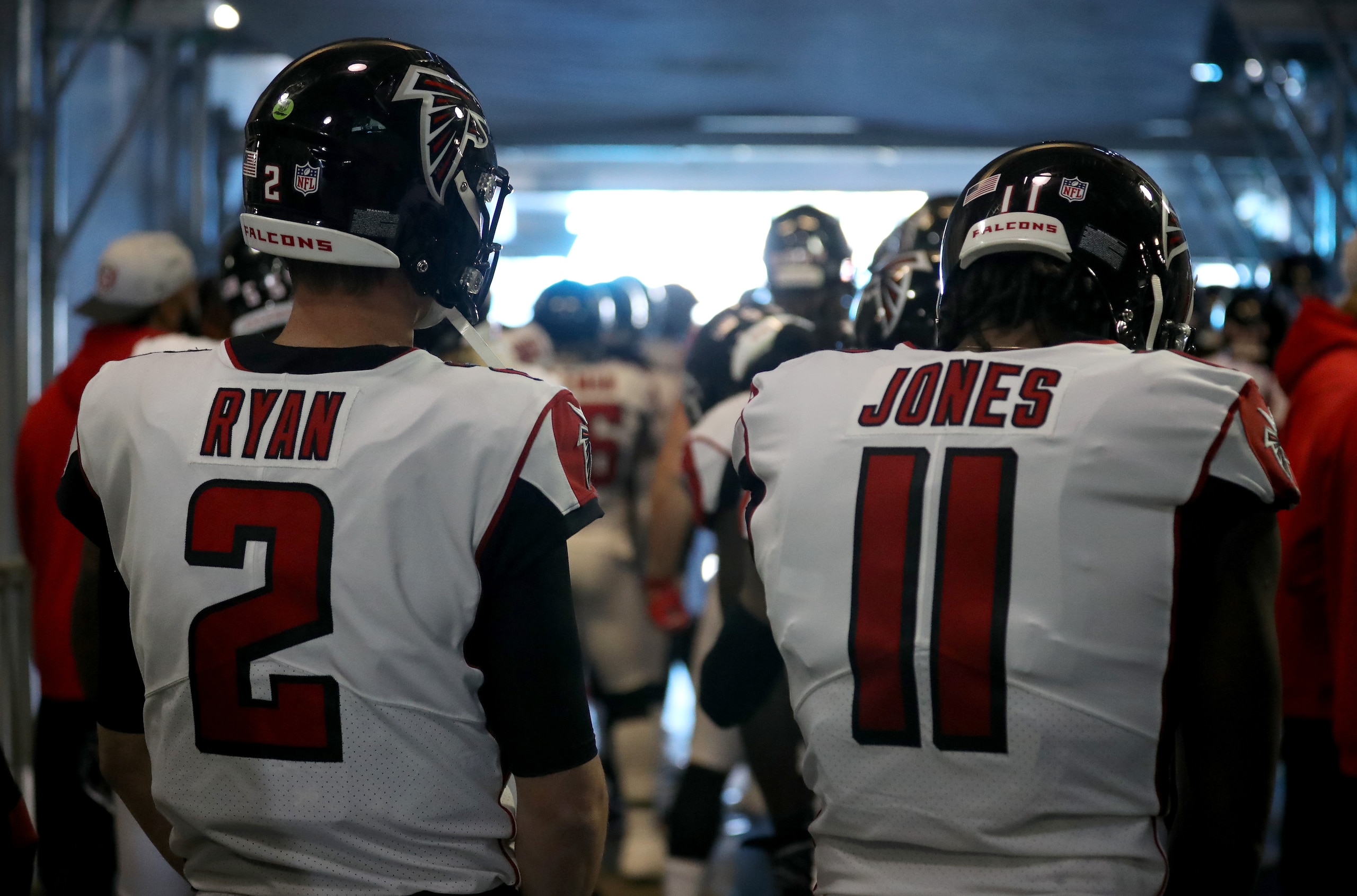 CHARLOTTE, NORTH CAROLINA - DECEMBER 23: Matt Ryan #2 and teammate Julio Jones #11 of the Atlanta Falcons wait to take the field against the Carolina Panthers at Bank of America Stadium on December 23, 2018 in Charlotte, North Carolina. (Photo by Streeter Lecka/Getty Images)