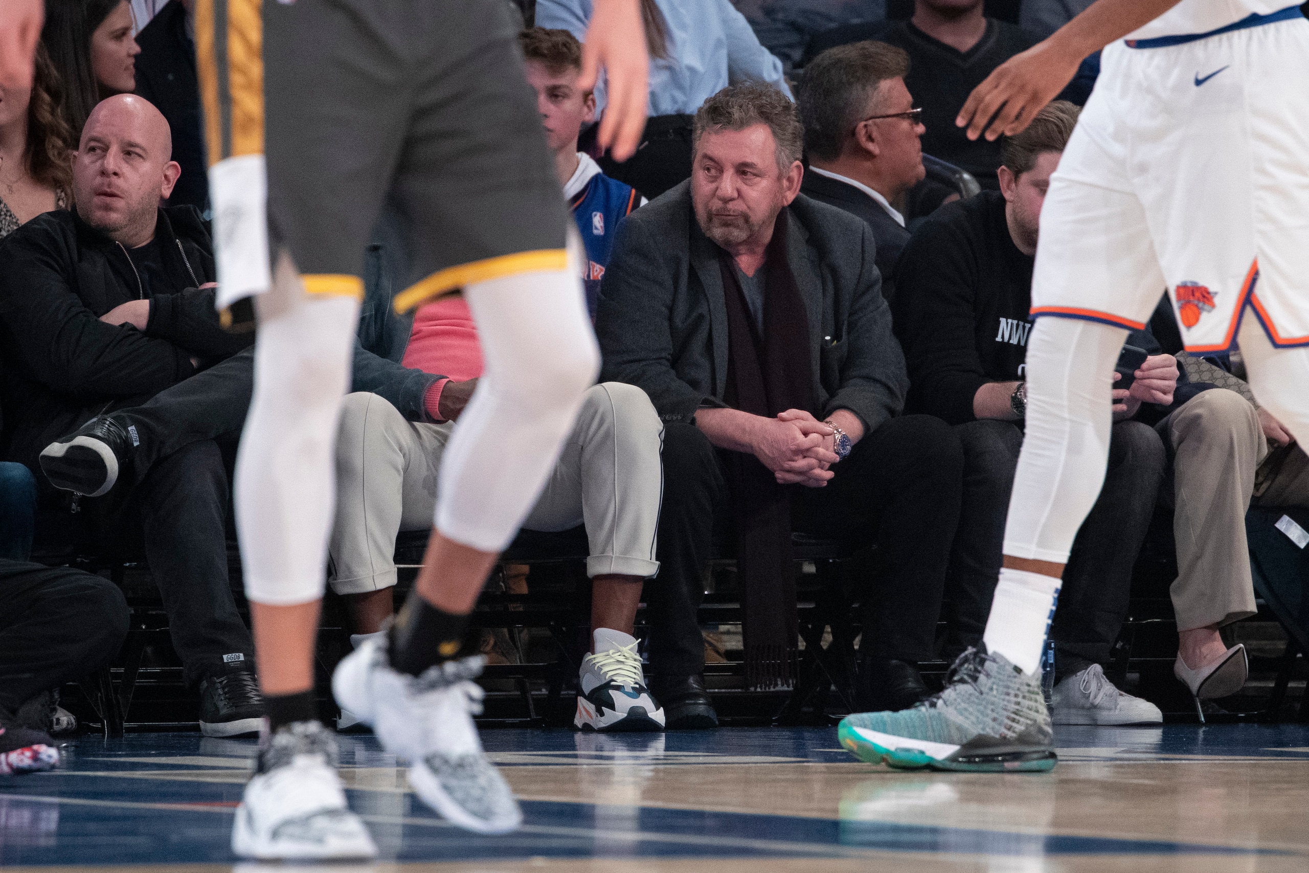 New York Knicks owner James Dolan, center, watches the game action in the first half of an NBA basketball game against the Oklahoma City Thunder, Friday, March 6, 2020, at Madison Square Garden in New York. (AP Photo/Mary Altaffer)