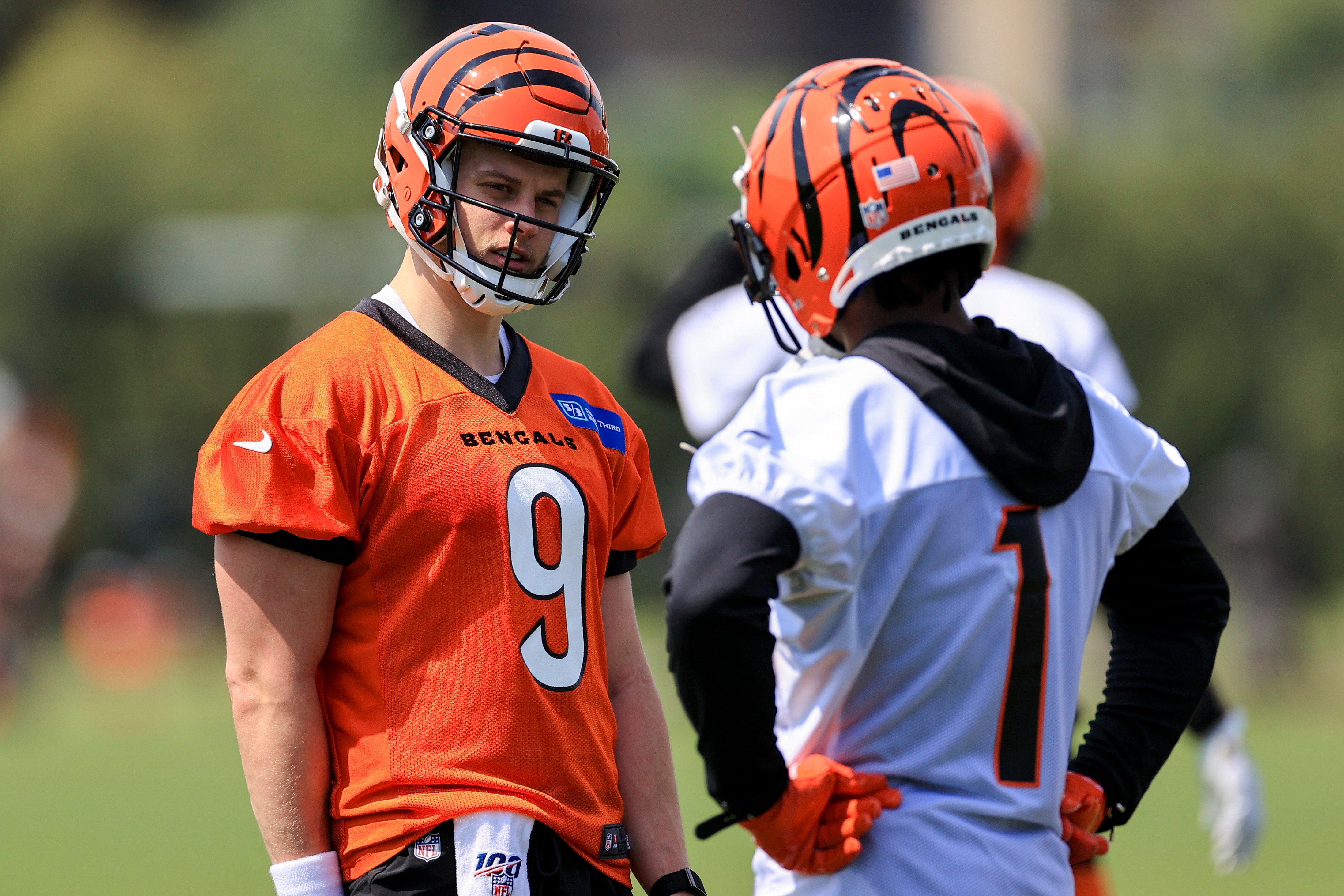 Cincinnati Bengals' Joe Burrow, left, talks with Ja'Marr Chase (1) during NFL football practice in Cincinnati, Tuesday, May 25, 2021. (AP Photo/Aaron Doster)