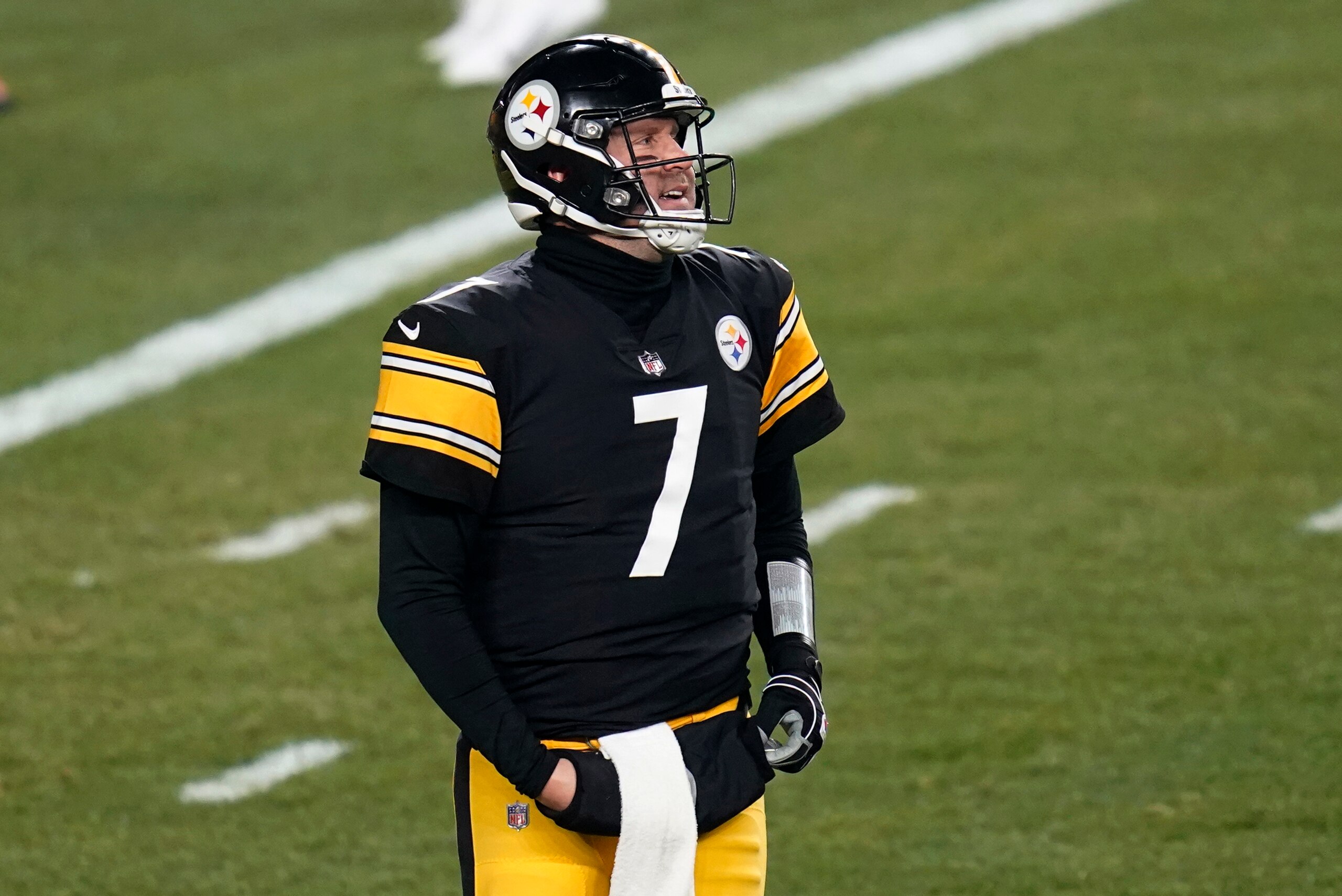 Pittsburgh Steelers quarterback Ben Roethlisberger (7) walks off the field after Cleveland Browns strong safety Karl Joseph (42) recovered a fumbled snap for a touchdown during the first half of an NFL wild-card playoff football game, Sunday, Jan. 10, 2021, in Pittsburgh. (AP Photo/Keith Srakocic)