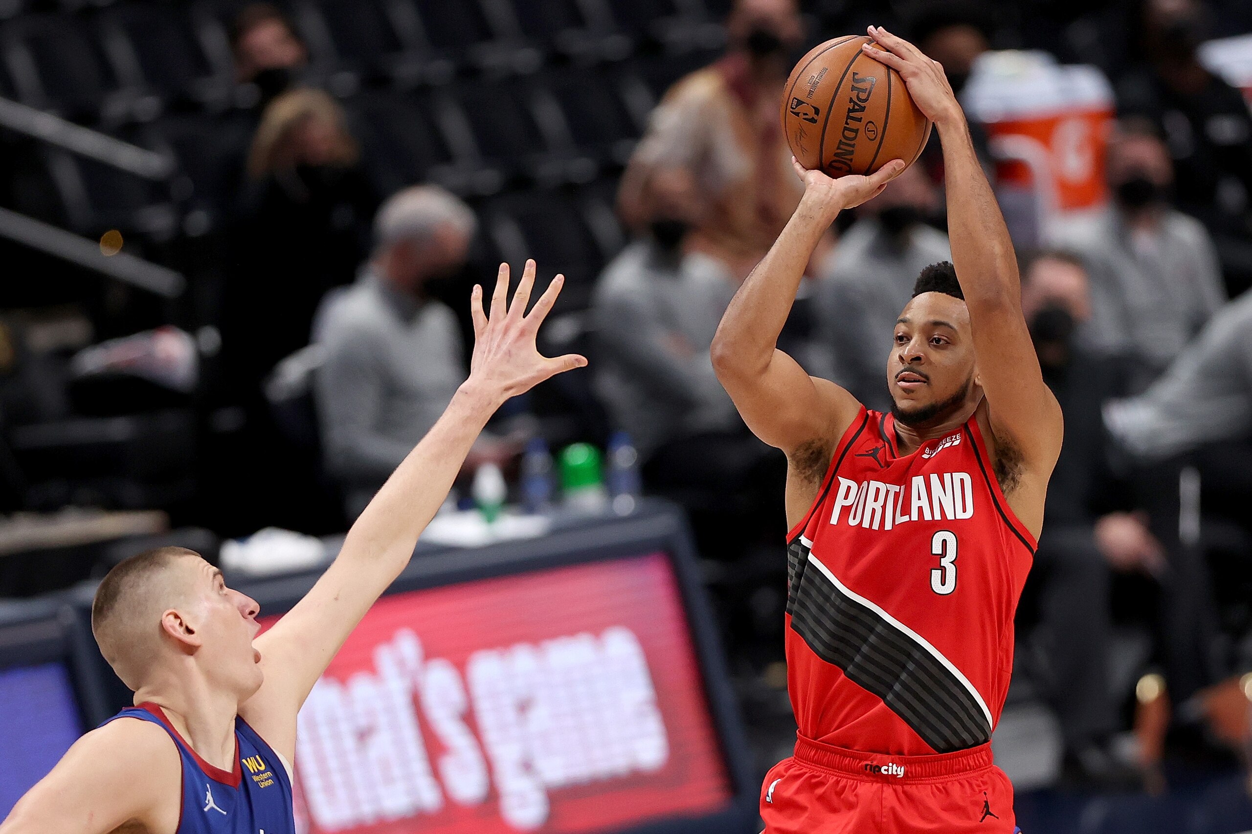 DENVER, COLORADO - MAY 22: CJ McCollum #3 of the Portland Trail Blazers puts up a shot over Nikola Jokic #15 of the Denver Nuggets in the third quarter during Game One of their Western Conference first-round playoff series at Ball Arena on May 22, 2021 in Denver, Colorado. NOTE TO USER: User expressly acknowledges and agrees that, by downloading and or using this photograph, User is consenting to the terms and conditions of the Getty Images License Agreement. (Photo by Matthew Stockman/Getty Images) DENVER, COLORADO - MAY 22: CJ McCollum #3 of the Portland Trail Blazers puts up a shot over Nikola Jokic #15 of the Denver Nuggets in the third quarter during Game One of their Western Conference first-round playoff series at Ball Arena on May 22, 2021 in Denver, Colorado. NOTE TO USER: User expressly acknowledges and agrees that, by downloading and or using this photograph, User is consenting to the terms and conditions of the Getty Images License Agreement. (Photo by Matthew Stockman/Getty Images)