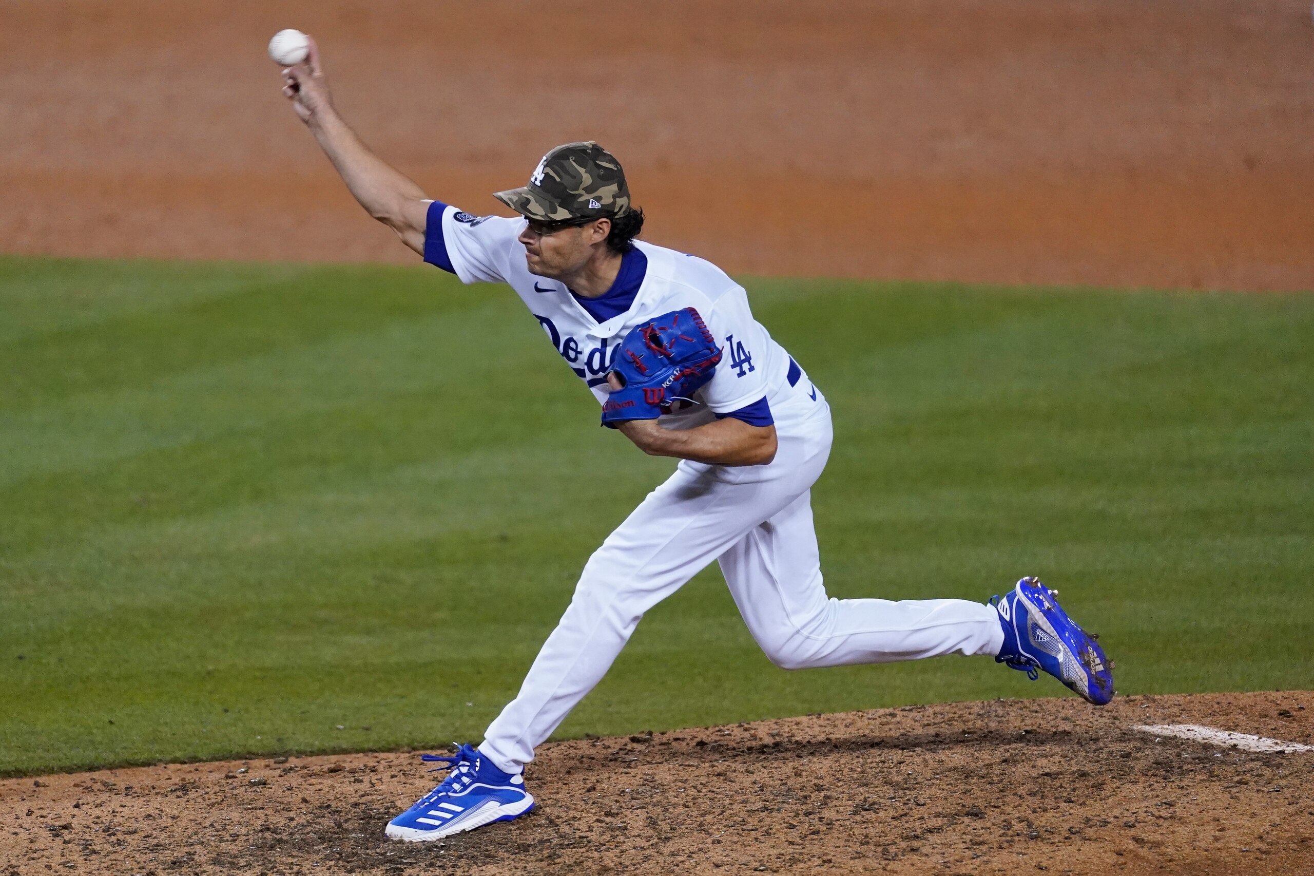 Los Angeles Dodgers relief pitcher Joe Kelly (17) throws during the ninth inning of a baseball game against the Miami Marlins Saturday, May 15, 2021, in Los Angeles. (AP Photo/Ashley Landis)