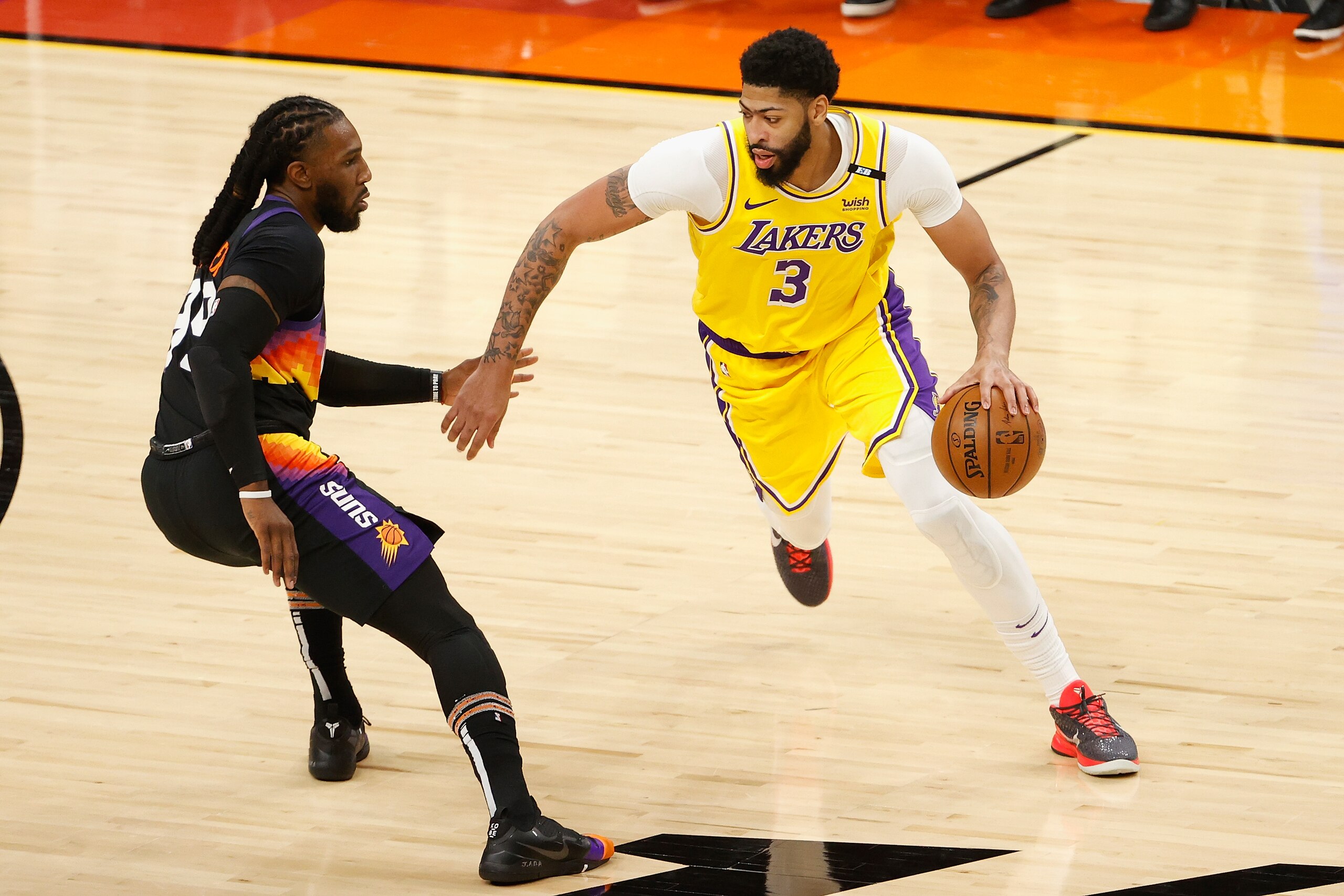 PHOENIX, ARIZONA - MAY 25: Anthony Davis #3 of the Los Angeles Lakers drives the ball against Jae Crowder #99 of the Phoenix Suns during the second half of Game Two of the Western Conference first-round playoff series at Phoenix Suns Arena on May 25, 2021 in Phoenix, Arizona. NOTE TO USER: User expressly acknowledges and agrees that, by downloading and or using this photograph, User is consenting to the terms and conditions of the Getty Images License Agreement.  (Photo by Christian Petersen/Getty Images)