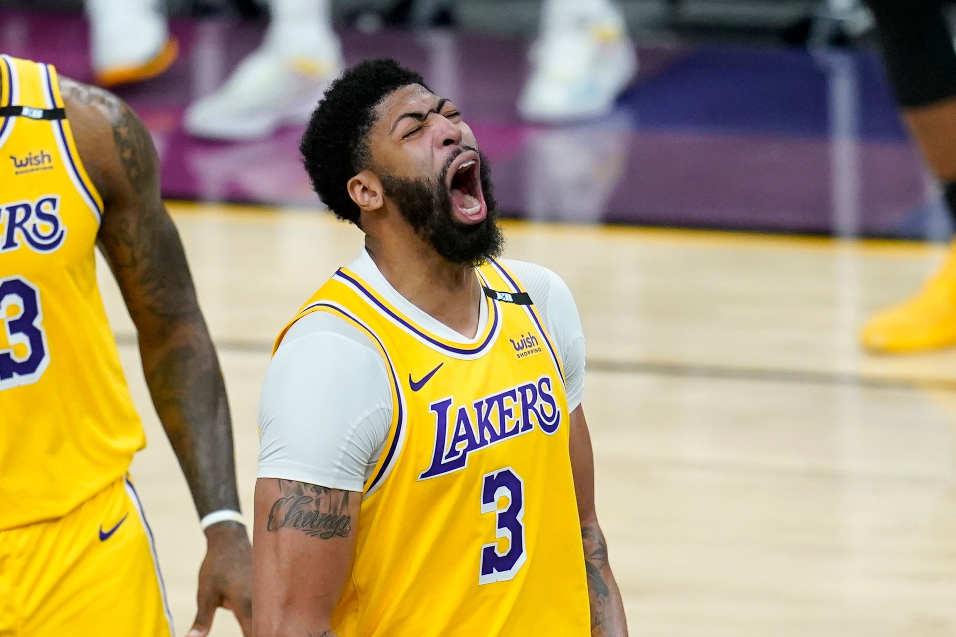 Los Angeles Lakers forward Anthony Davis shouts as he celebrates a stop against the Phoenix Suns during the second half of Game 2 of an NBA basketball first-round playoff series Tuesday, May 25, 2021, in Phoenix. The Lakers defeated the Suns 109-102. (AP Photo/Ross D. Franklin) Los Angeles Lakers forward Anthony Davis shouts as he celebrates a stop against the Phoenix Suns during the second half of Game 2 of an NBA basketball first-round playoff series Tuesday, May 25, 2021, in Phoenix. The Lakers defeated the Suns 109-102. (AP Photo/Ross D. Franklin)