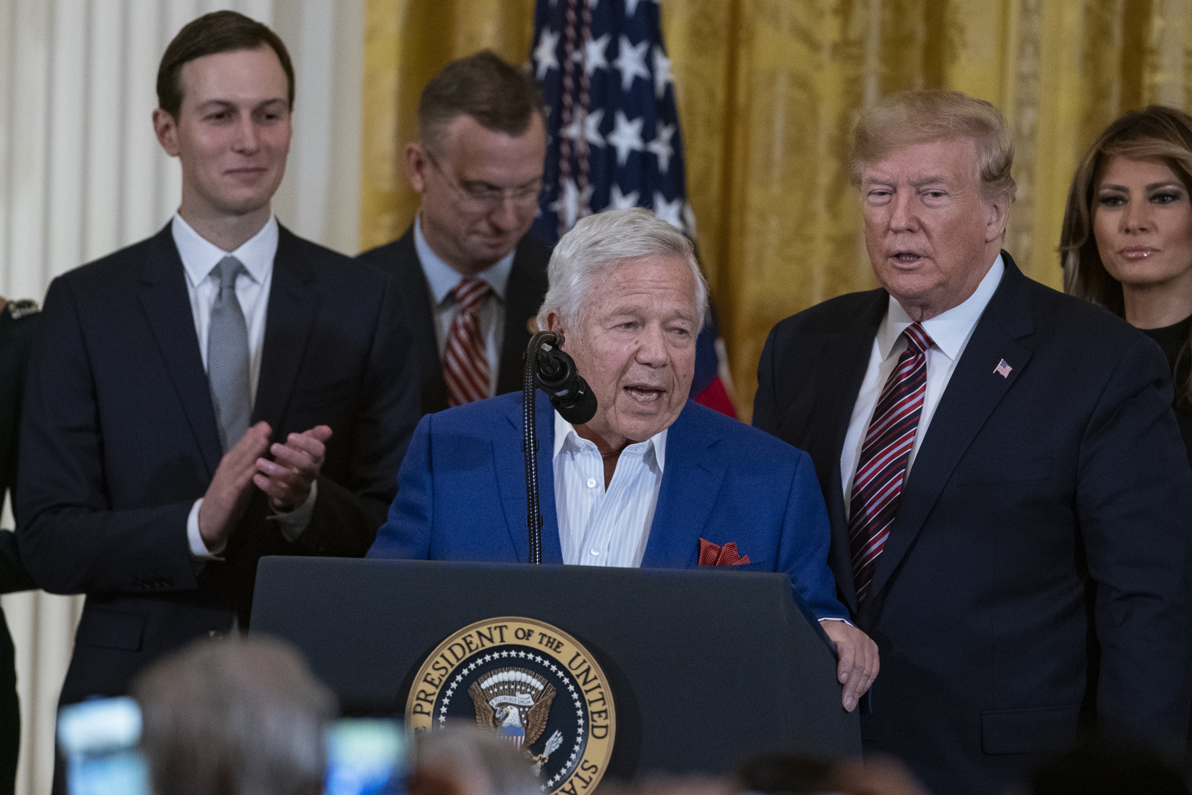 Robert Kraft, chief executive officer of Kraft Group and owner of the New England Patriots, center, speaks during a Hanukkah reception at the White House in Washington, D.C., U.S., on Wednesday, Dec. 11, 2019. During the event U.S. President Donald Trump signed an executive order stating that colleges and universities that allow groups with anti-Semitic beliefs to operate on their campuses will not receive federal educational funding. Photographer: Alex Edelman/Bloomberg via Getty Images