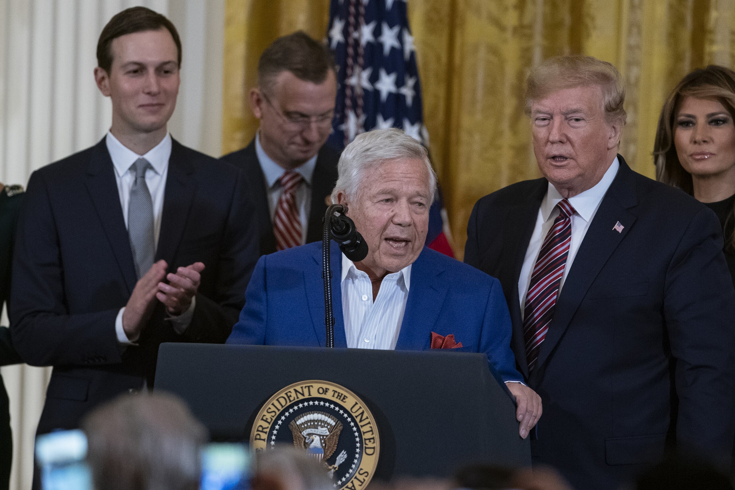 Robert Kraft, chief executive officer of Kraft Group and owner of the New England Patriots, center, speaks during a Hanukkah reception at the White House in Washington, D.C., U.S., on Wednesday, Dec. 11, 2019. During the event U.S. President Donald Trump signed an executive order stating that colleges and universities that allow groups with anti-Semitic beliefs to operate on their campuses will not receive federal educational funding. Photographer: Alex Edelman/Bloomberg via Getty Images